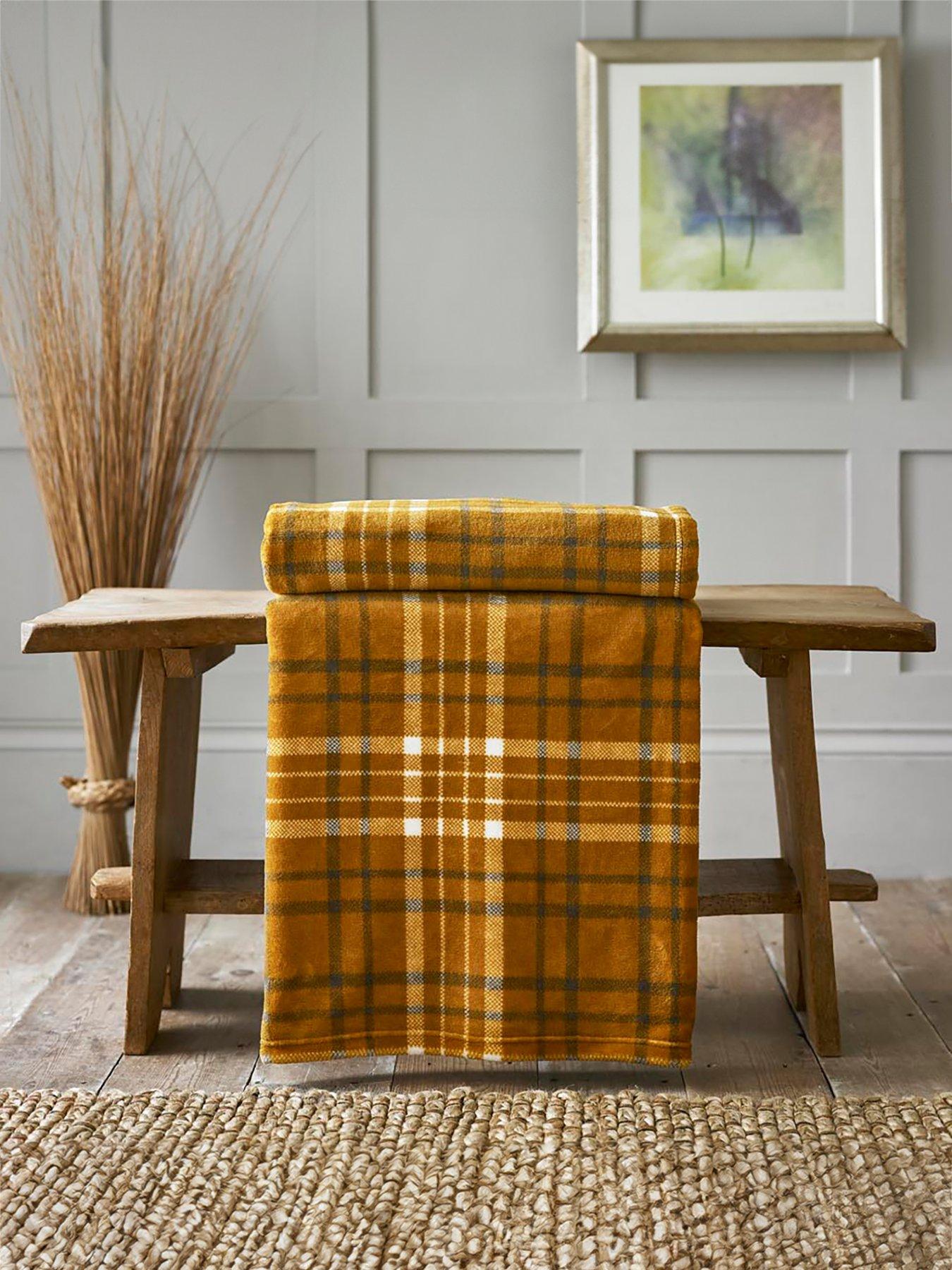 Product photograph of Deyongs Snuggle Touch Tartan Throw from very.co.uk