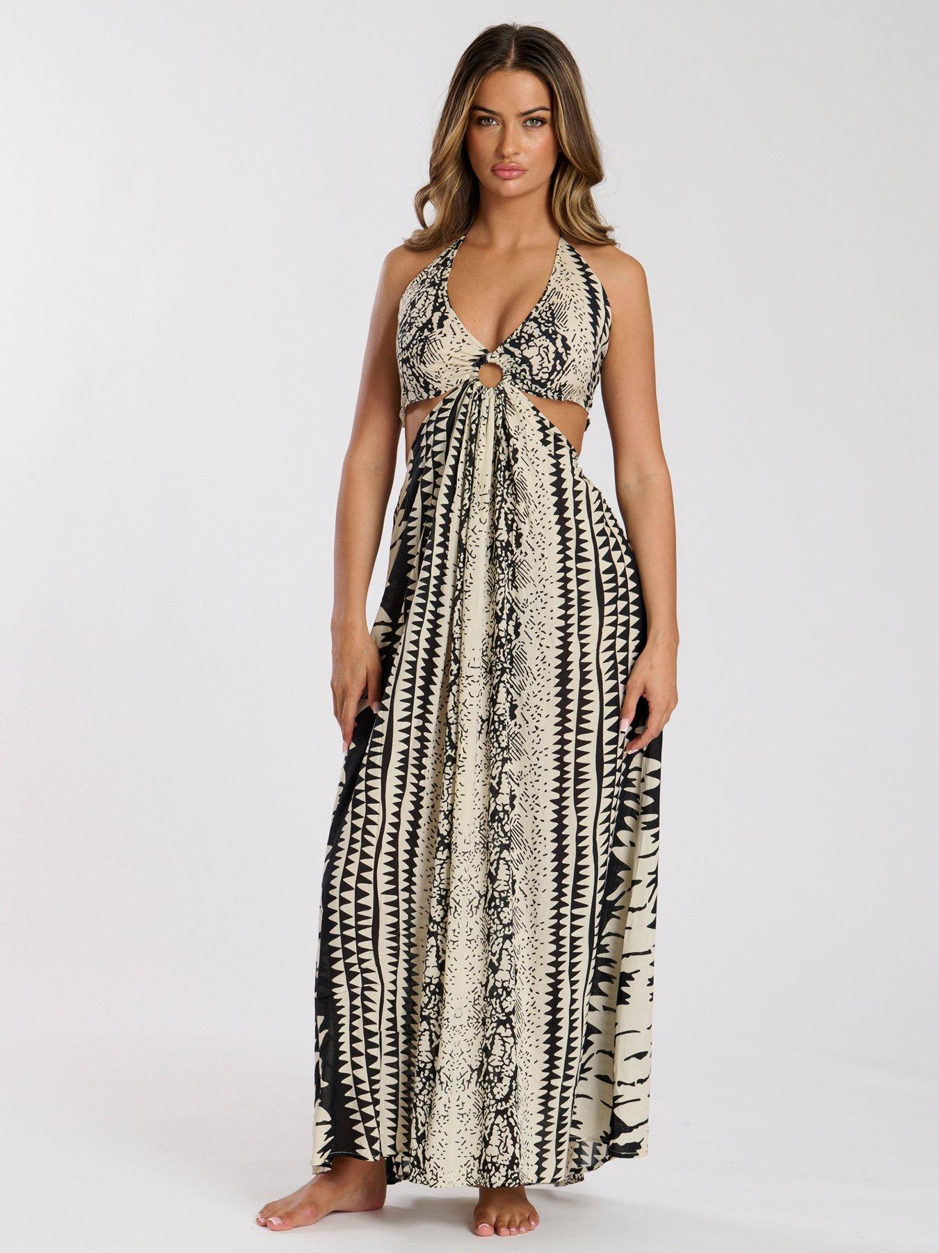 Image 1 of 5 of South Beach Printed Halter neck Ring Detail Beach Maxi Dress