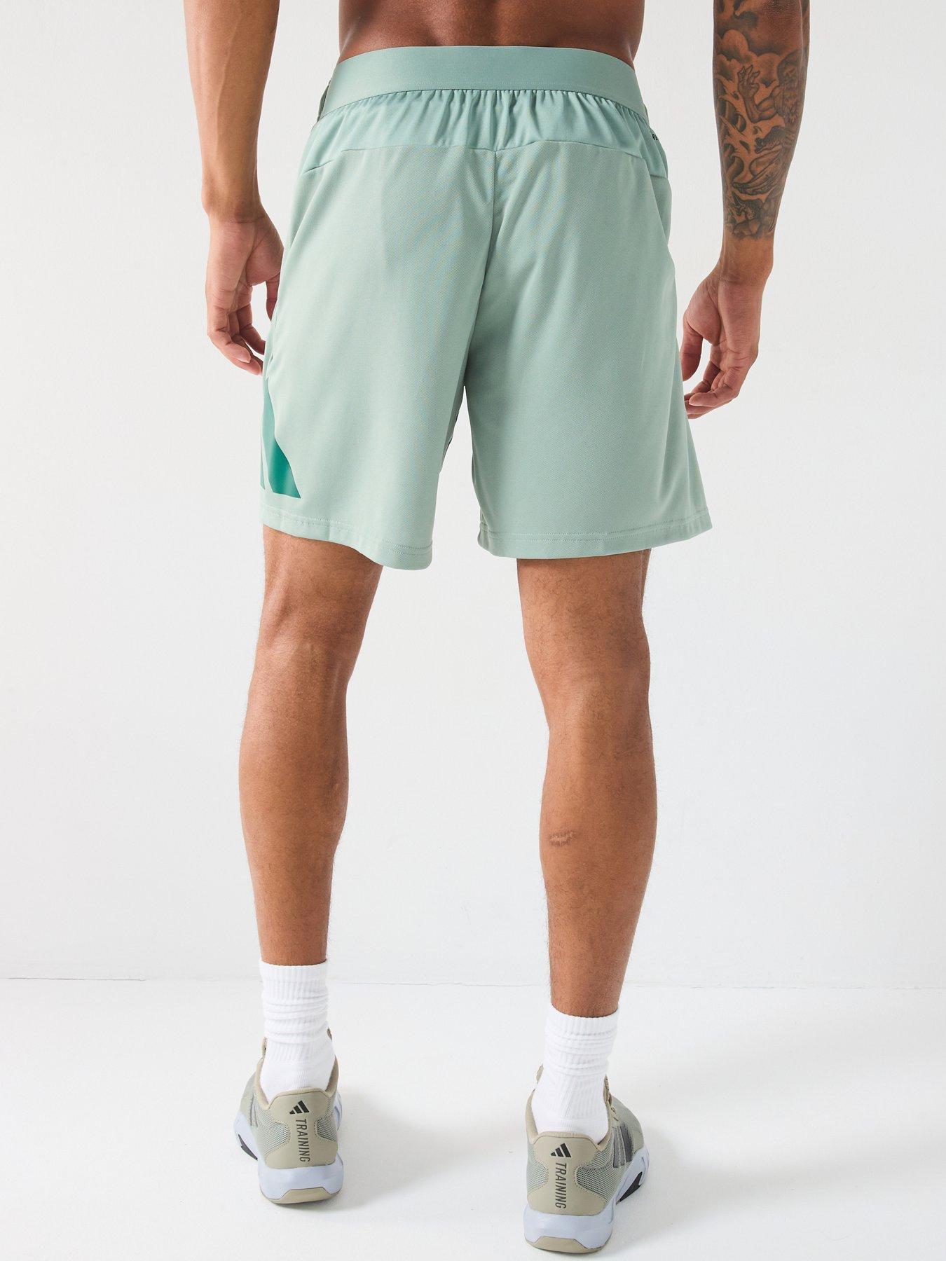 Image 2 of 6 of adidas Men's Train Essentials 7 Inch Logo Shorts - Silver Green/Collegiate Green
