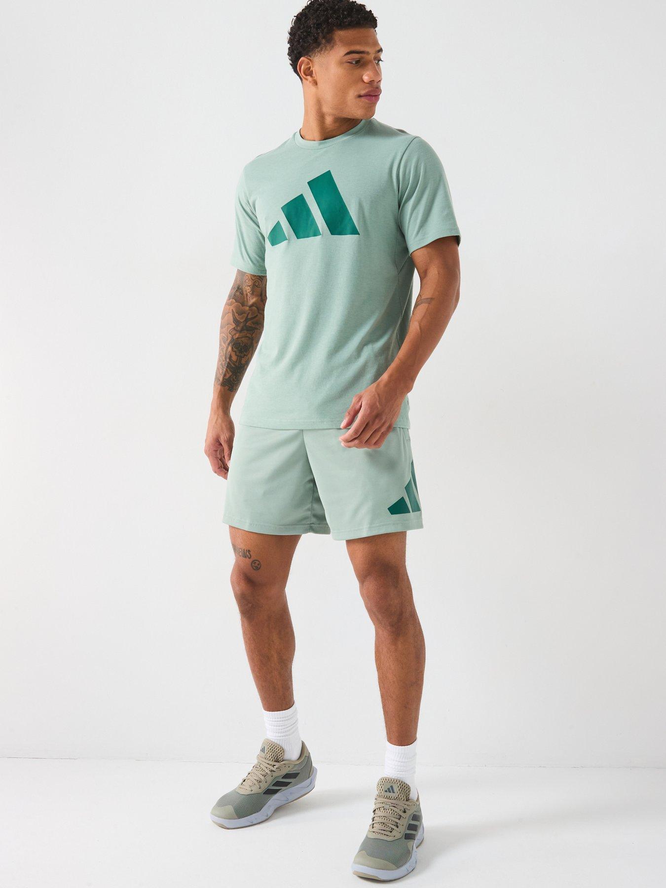 Image 6 of 6 of adidas Men's Train Essentials 7 Inch Logo Shorts - Silver Green/Collegiate Green