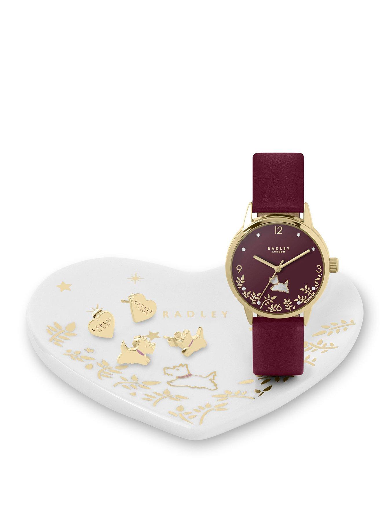 Product photograph of Radley Gold Plated Cranberry Red Leather Watch 18ct Gold Plated Earring Twin Pack And Ceramic Trinket Tray Set from very.co.uk