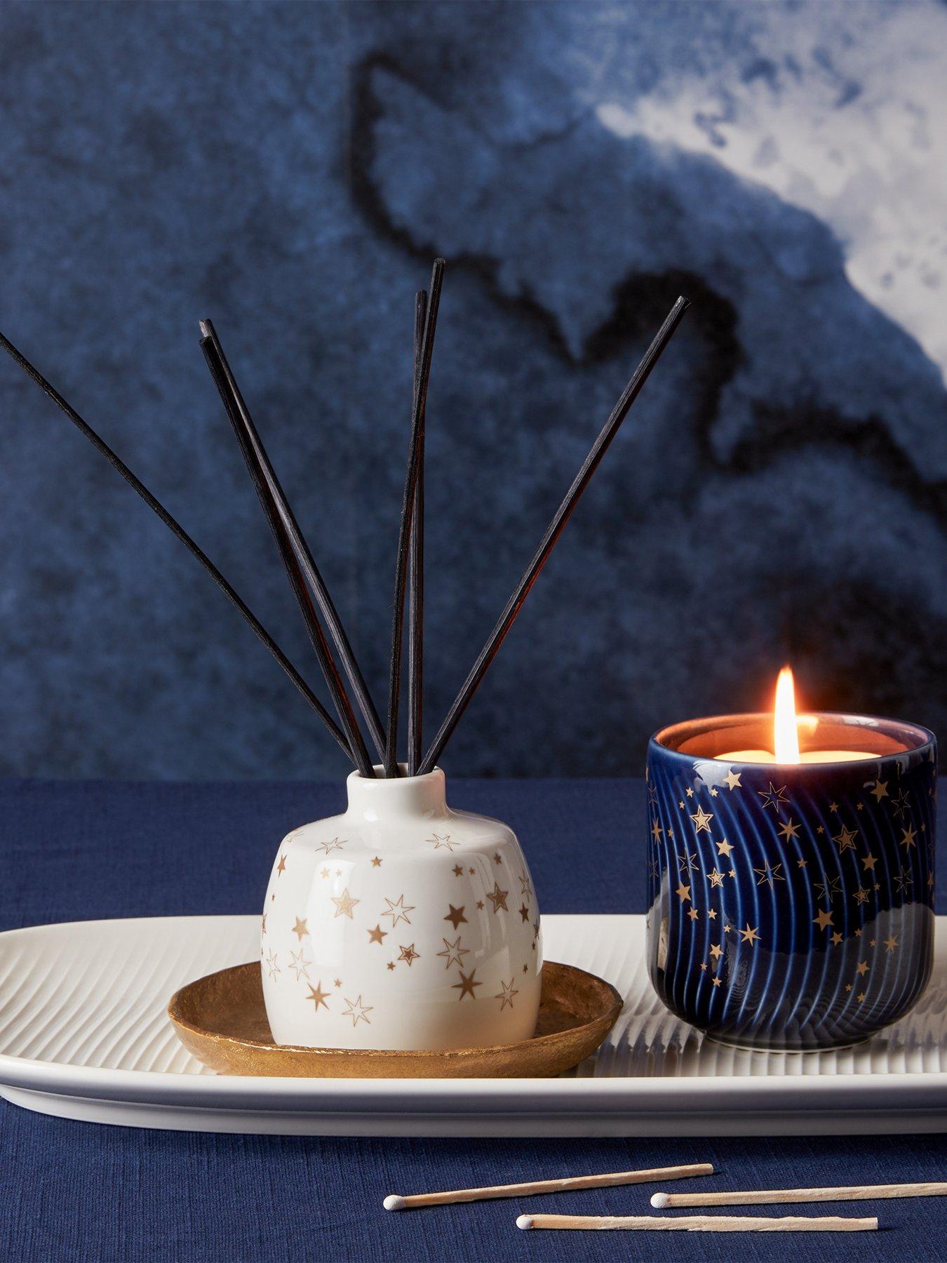 Product photograph of Denby Porcelain Blue Arc Stars Candle from very.co.uk