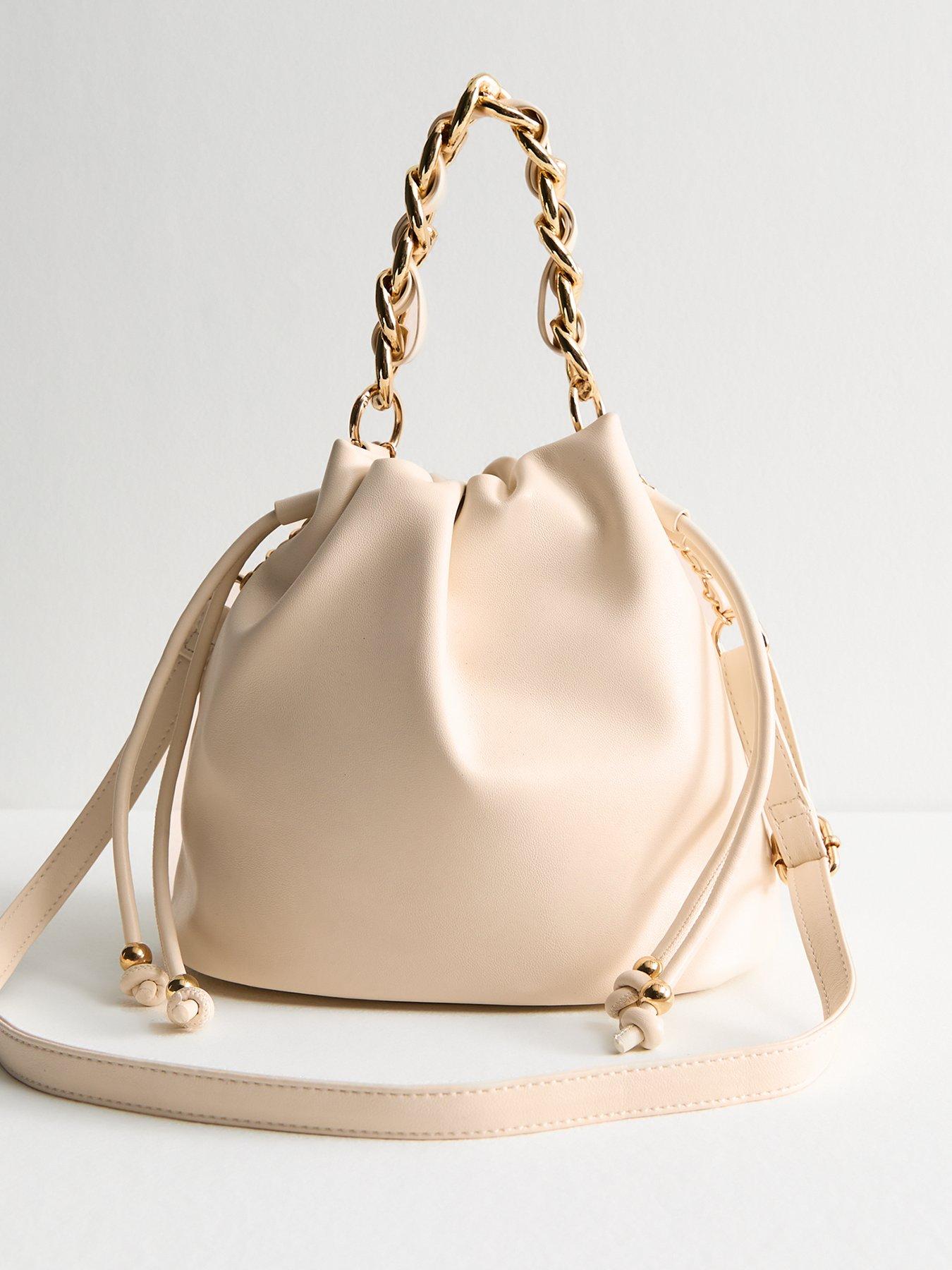undefined Cream Faux Leather Drawstring Crossbody Bag