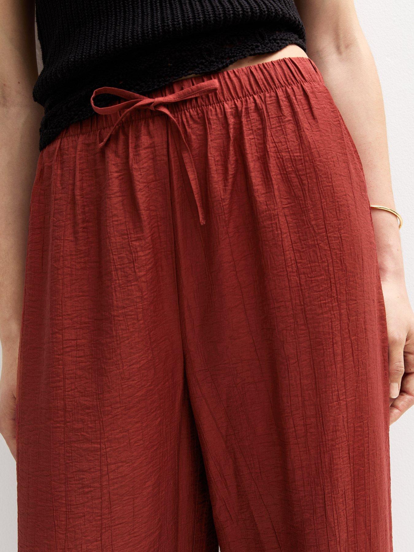 Image 4 of 5 of New Look Crinkled Wide Leg Trousers - Dark Red