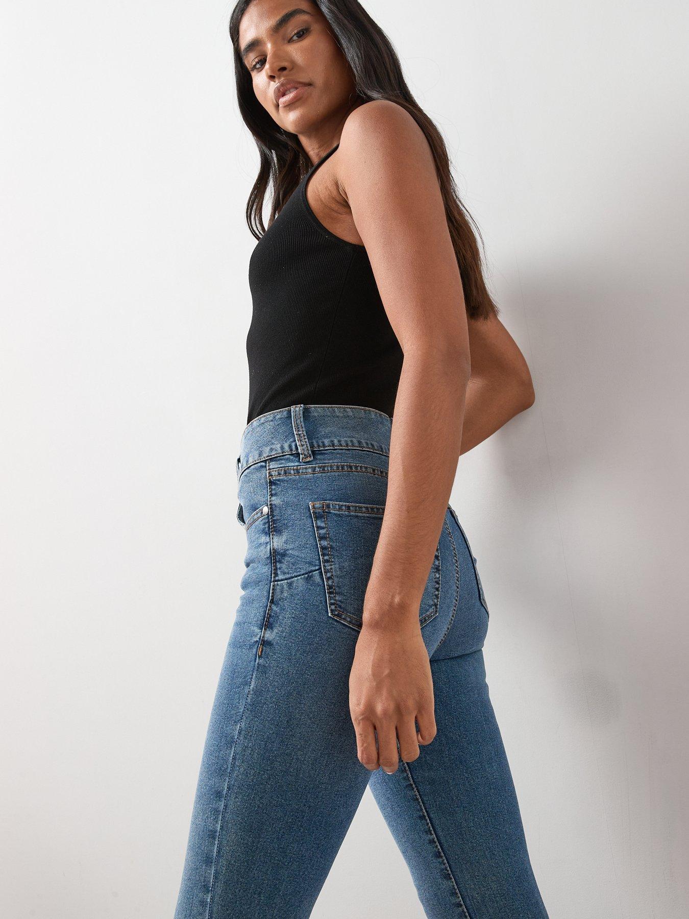 Image 6 of 7 of The Very Collection Shaping Double Button Skinny Jeans - Mid Wash