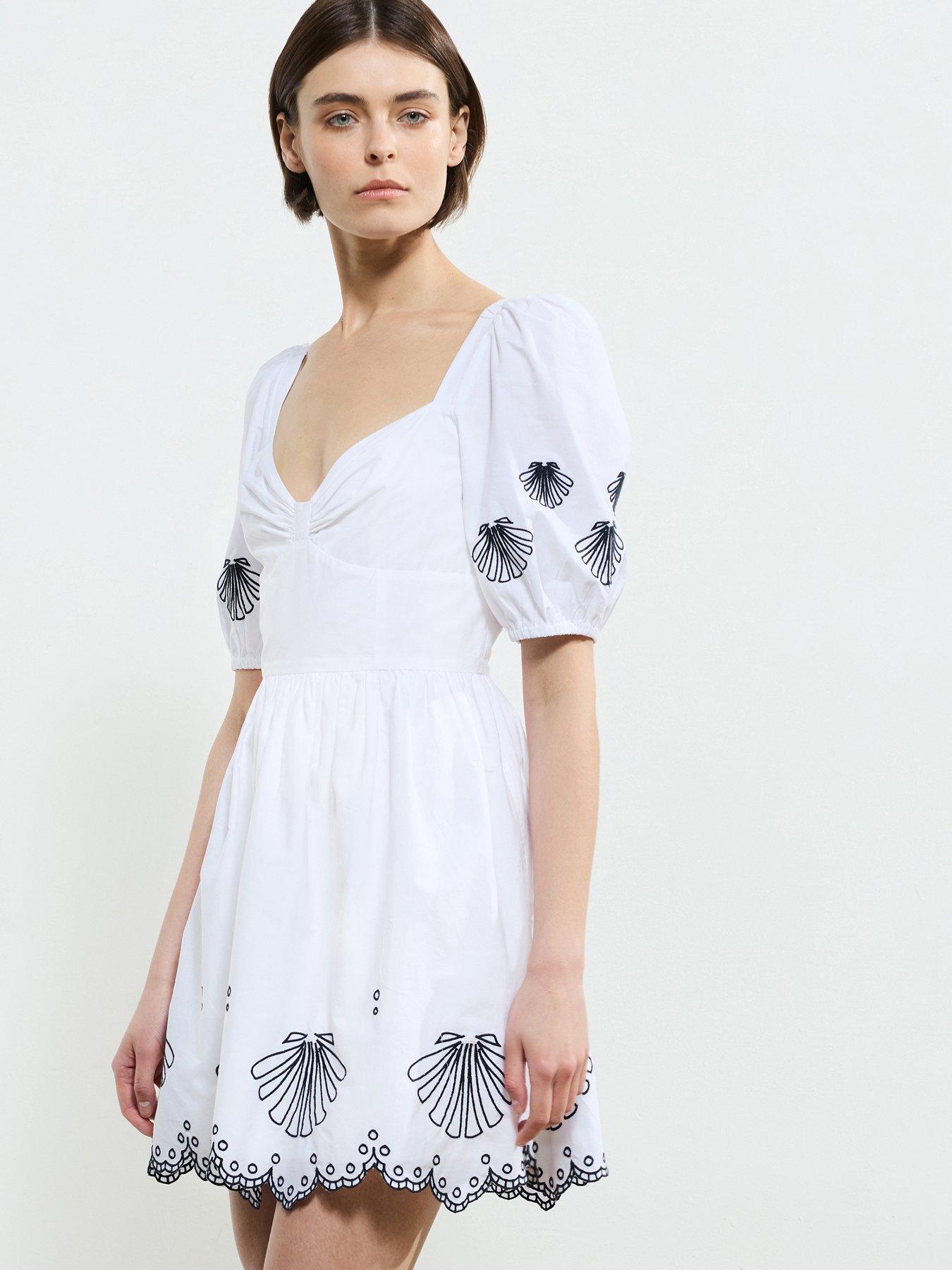 Image 1 of 6 of French Connection Cotton Embroidered Bow Neck Puff Sleeve Babydoll Dress