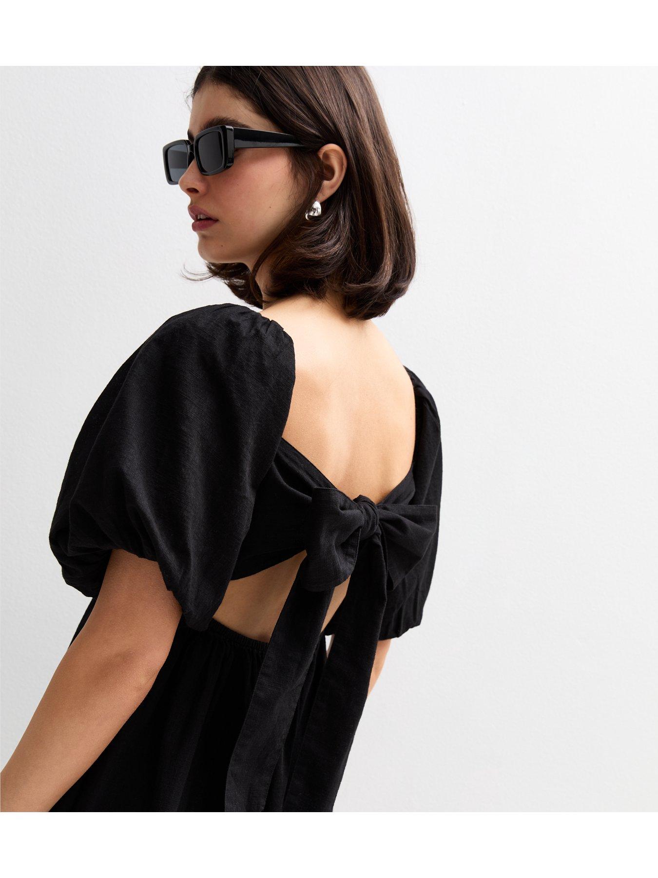 Image 4 of 5 of New Look Puff Sleeve Knotted Front Midi Dress - Black