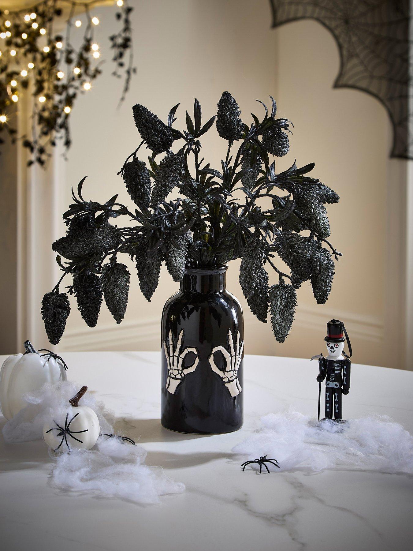 undefined Fruit Foliage Display In A Skeleton Hand Halloween Vase