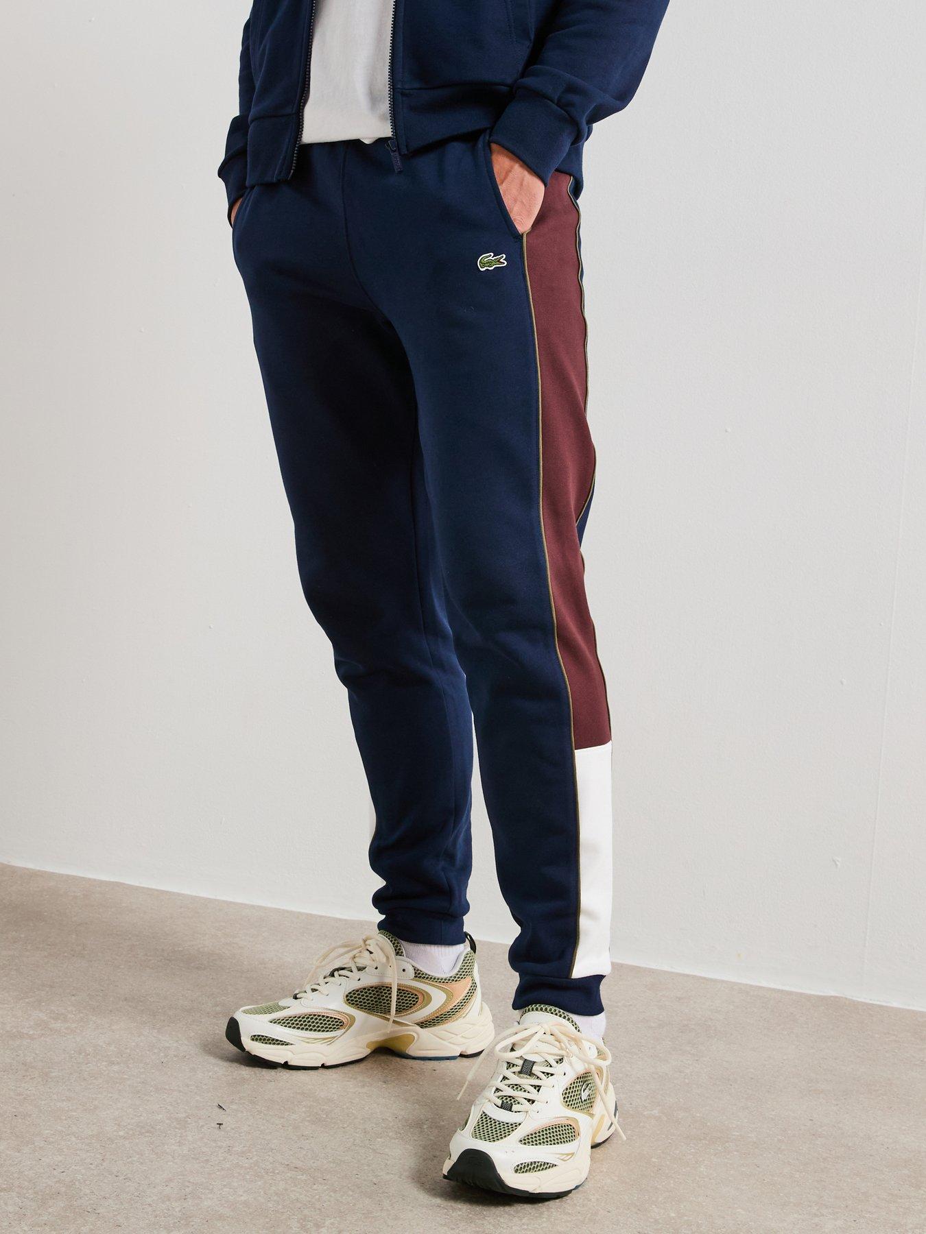 Image 1 of 6 of Lacoste Tapered Fit Colour Block Sweatpants - Navy