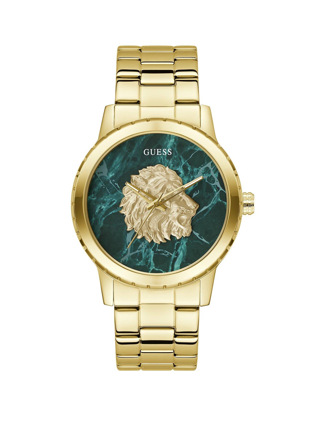 Guess gold tone green dial with lion head and gold tone bracelet
