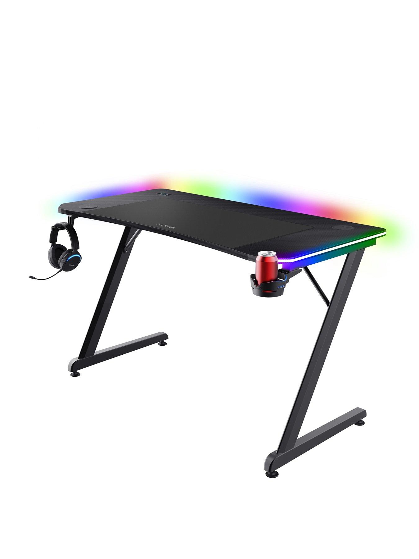 Image 1 of 8 of Trust GXT710 Luminus Pro Gaming Desk with LED RGB, 10 Colour Modes, Built-in 10W Wireless Charger - Black