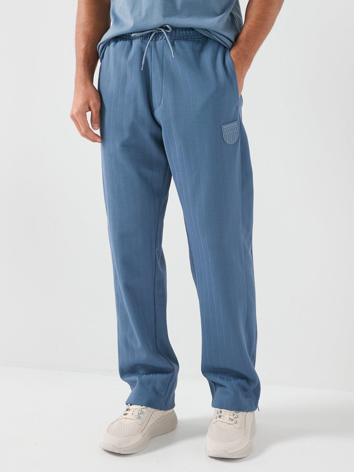 Image 1 of 6 of HUGO Davropant Rib Shield Logo Tracksuit Bottoms - Blue