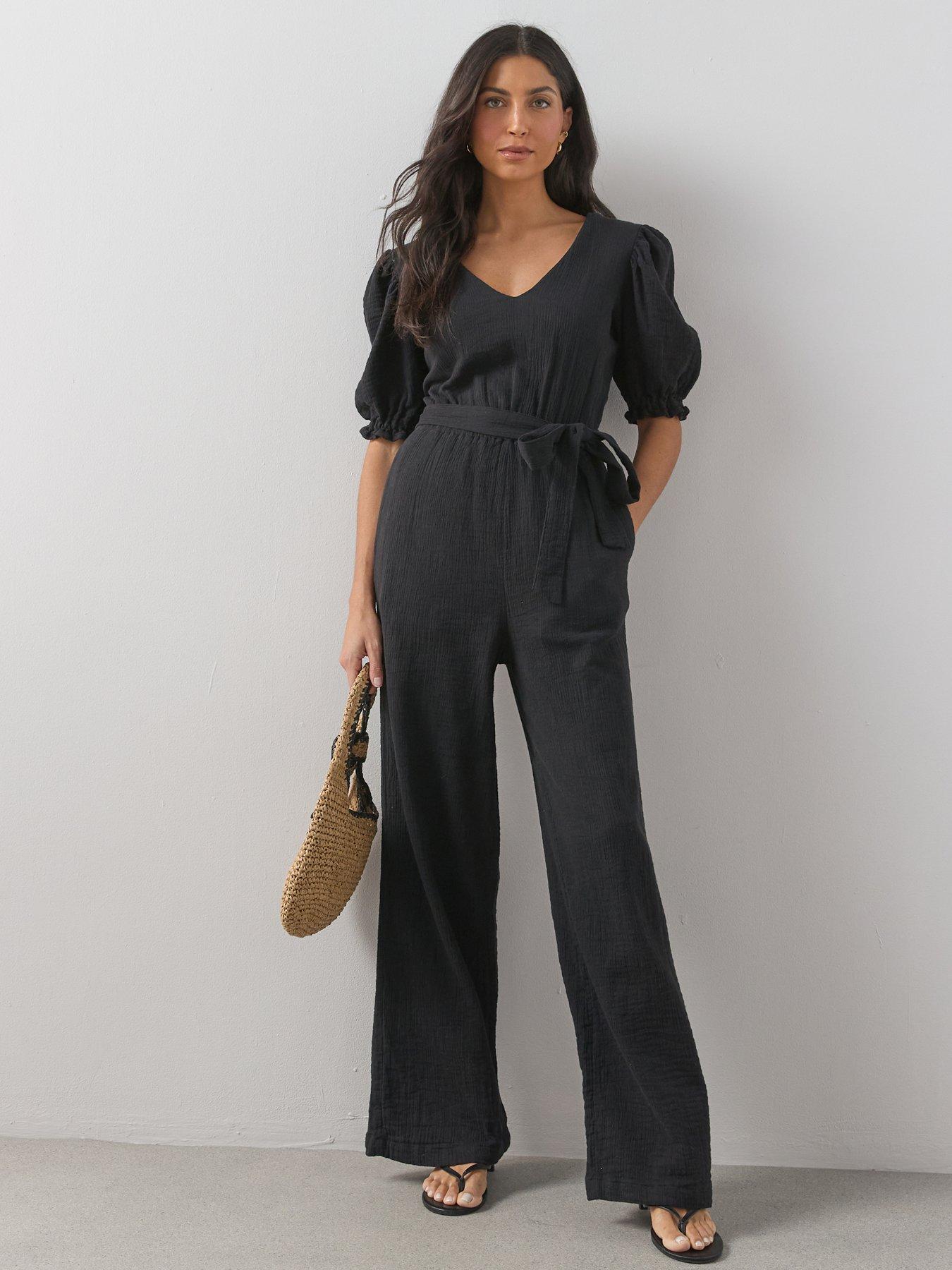 Image 1 of 6 of The Very Collection Cheese Cloth Puff Sleeve Belted Jumpsuit - Black