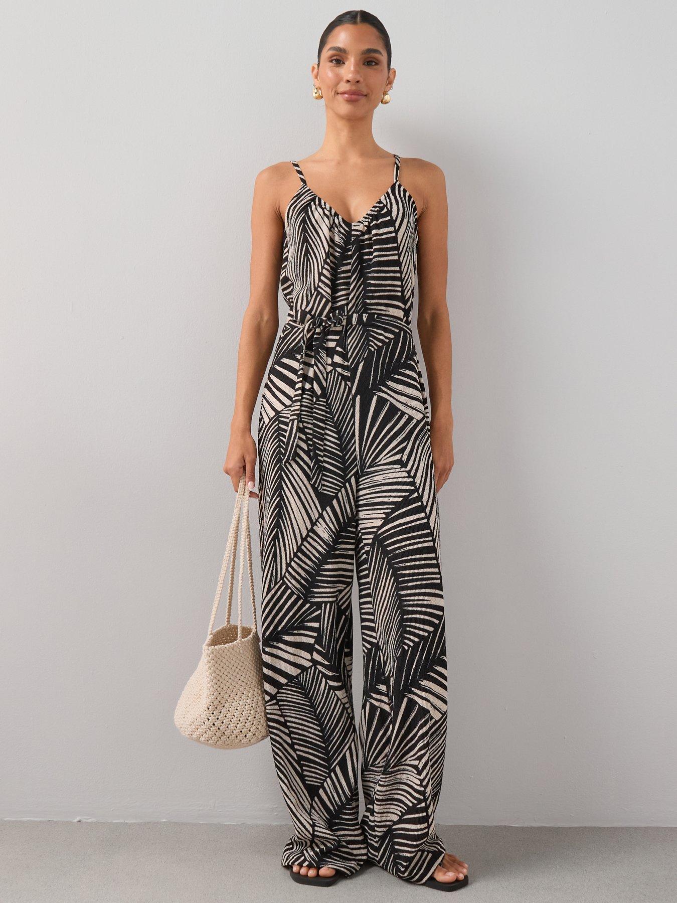 Image 1 of 7 of The Very Collection Textured Stretch Strappy Jumpsuit