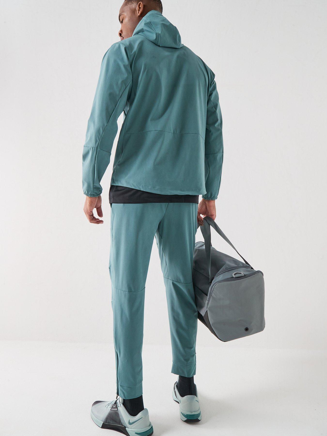 Image 3 of 7 of Nike Mens Training Dri-FIT Zippered Cuff Versatile Pants - Green