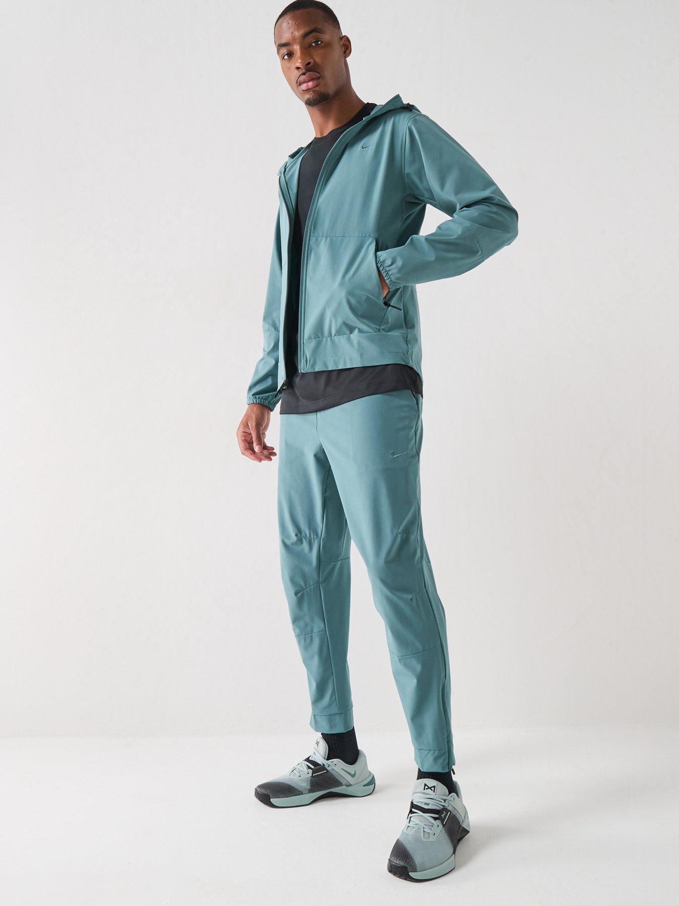 Image 4 of 7 of Nike Mens Training Dri-FIT Zippered Cuff Versatile Pants - Green