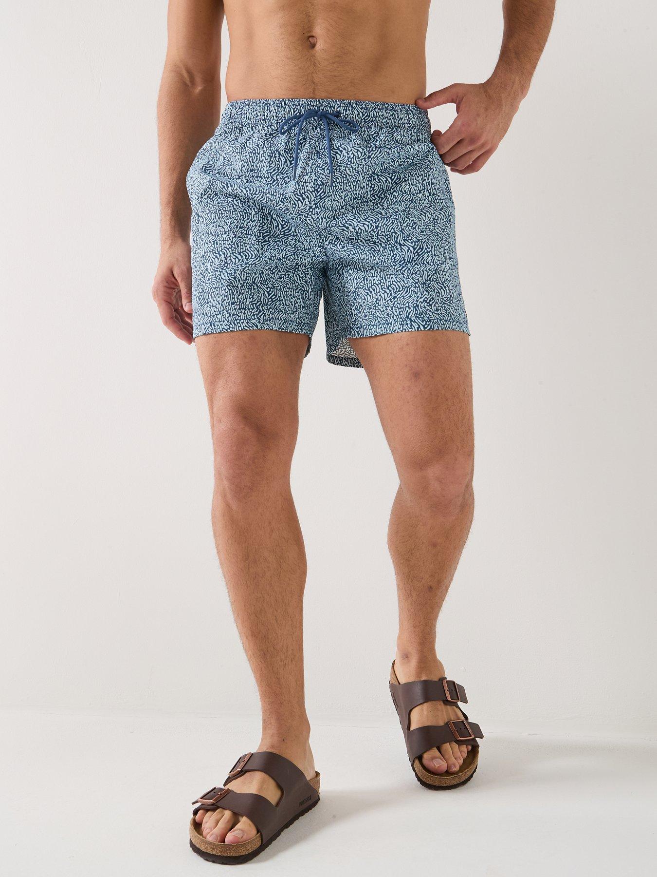 Image 1 of 6 of Tommy Hilfiger Essential All Over Print Medium Swim Shorts - Blue