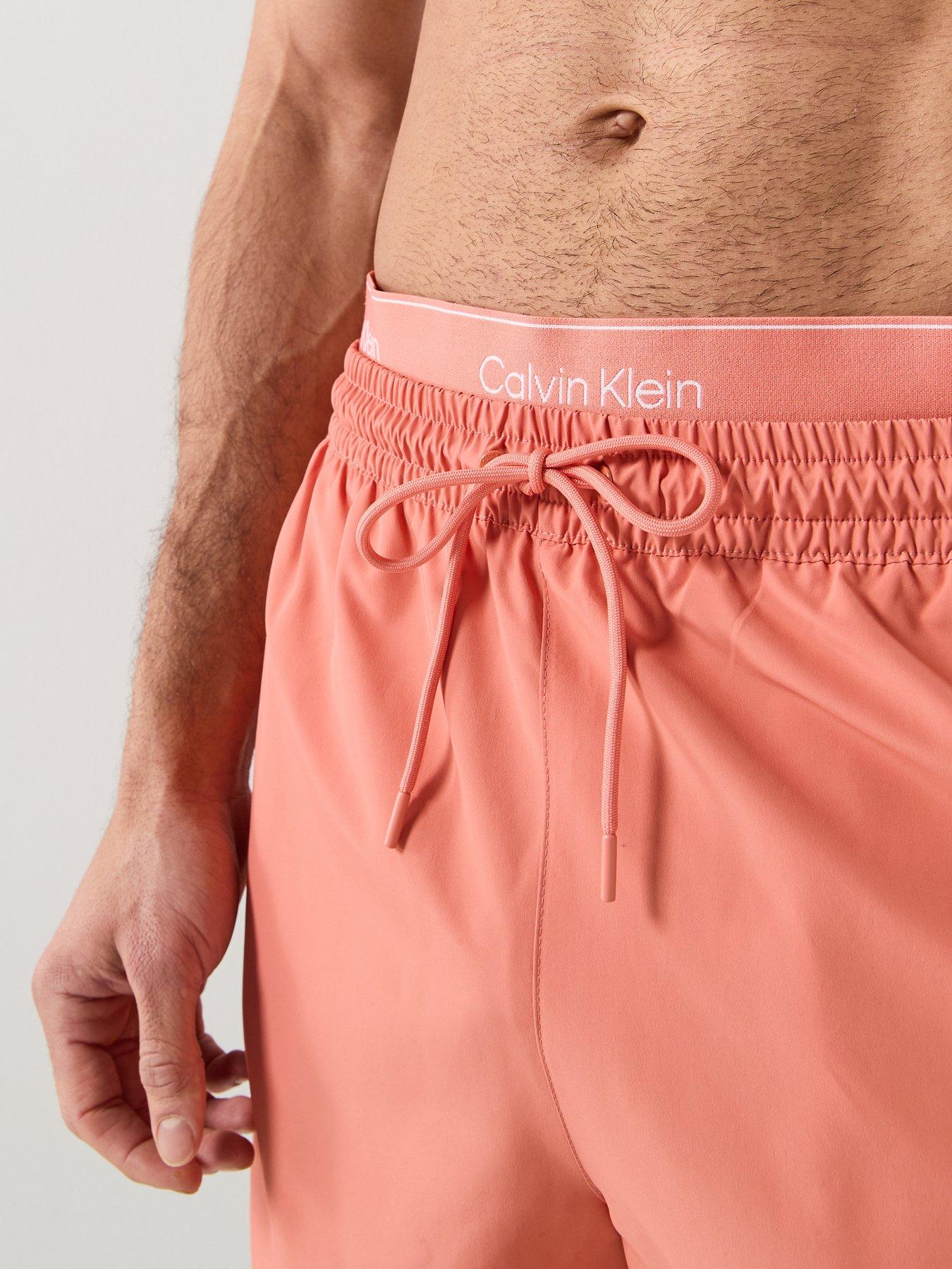 Image 4 of 5 of Calvin Klein Essential Double Waistband Medium Swim Shorts - Orange