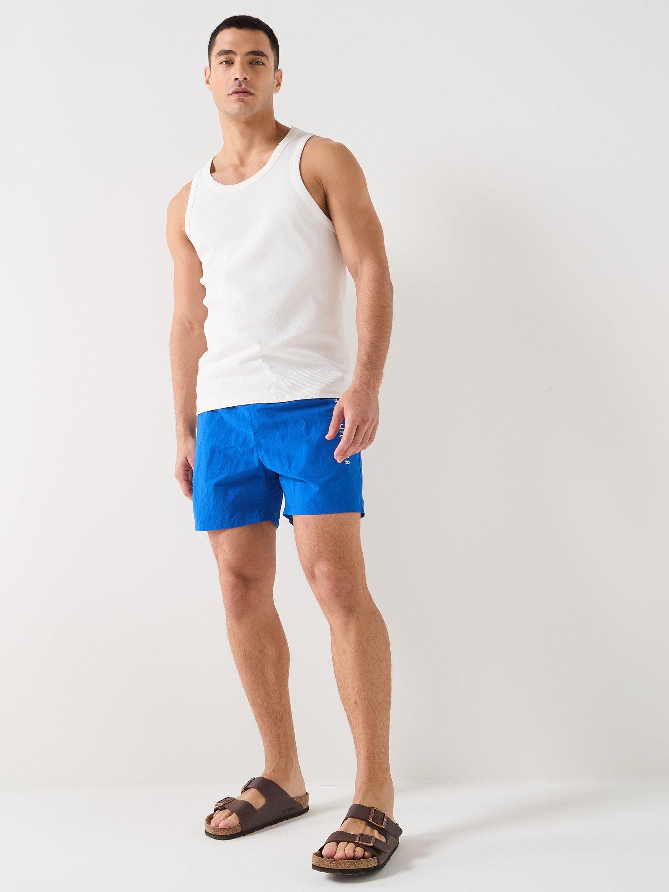 Image 3 of 6 of Tommy Hilfiger Side Linear Logo Swim Shorts - Blue