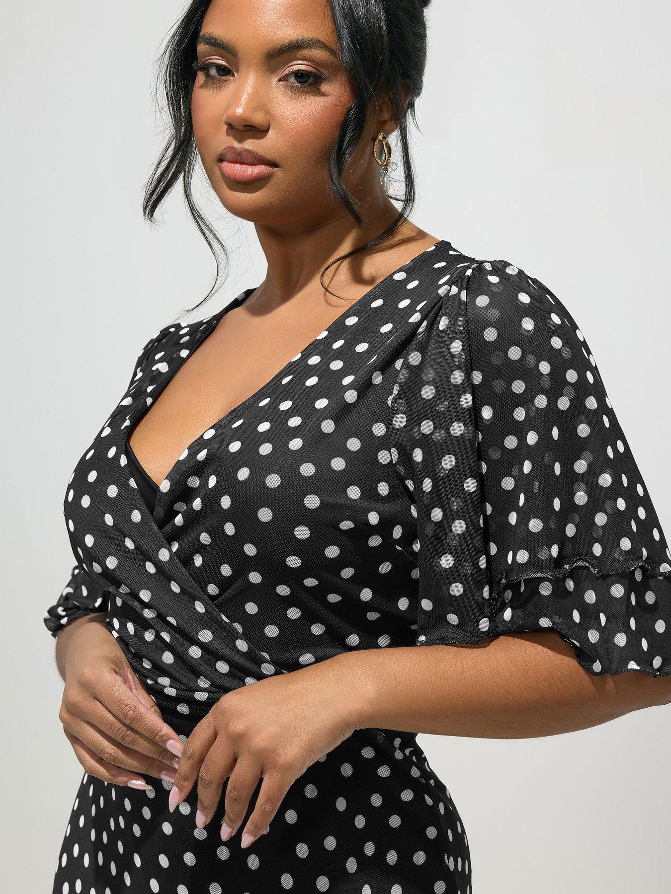 Image 4 of 5 of Yours Curve Polka Dot Mesh Ruffle Wrap Dress - Black