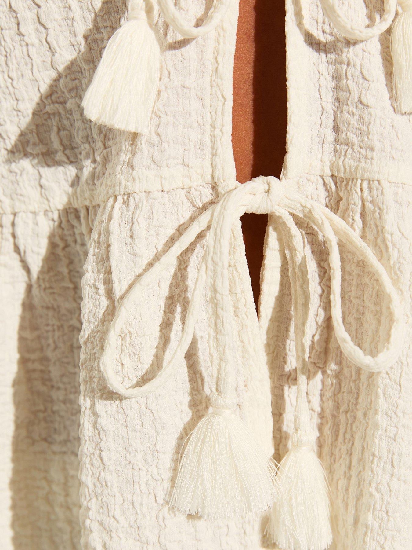 Image 6 of 7 of New Look Textured Jersey Peplum Beach Top - White