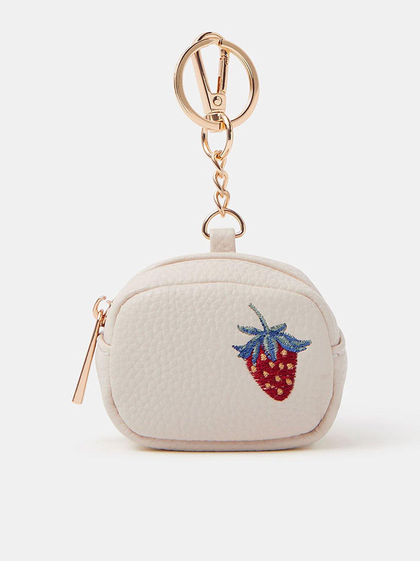 Image 1 of 3 of Accessorize Strawberry Airpod Case Keyring - Cream