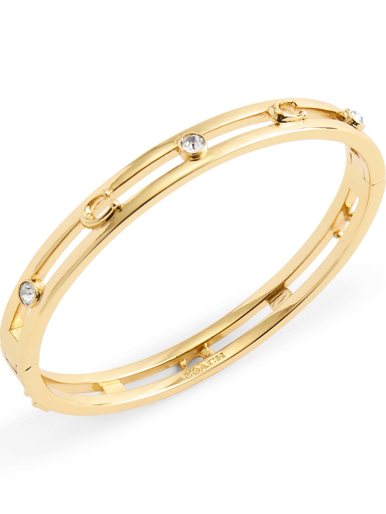Image 1 of 3 of COACH Open C Hinged Bangle - Gold