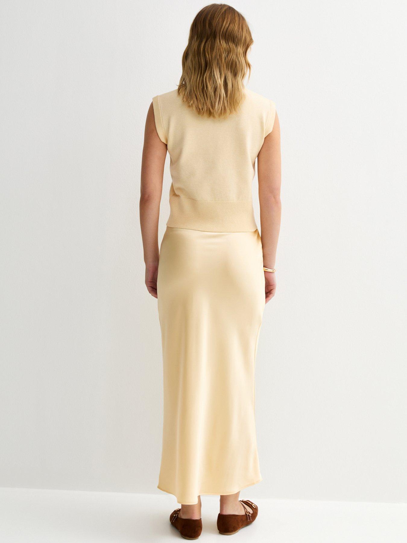 Image 2 of 5 of New Look Satin Bias Cut Midi Skirt - Light Yellow
