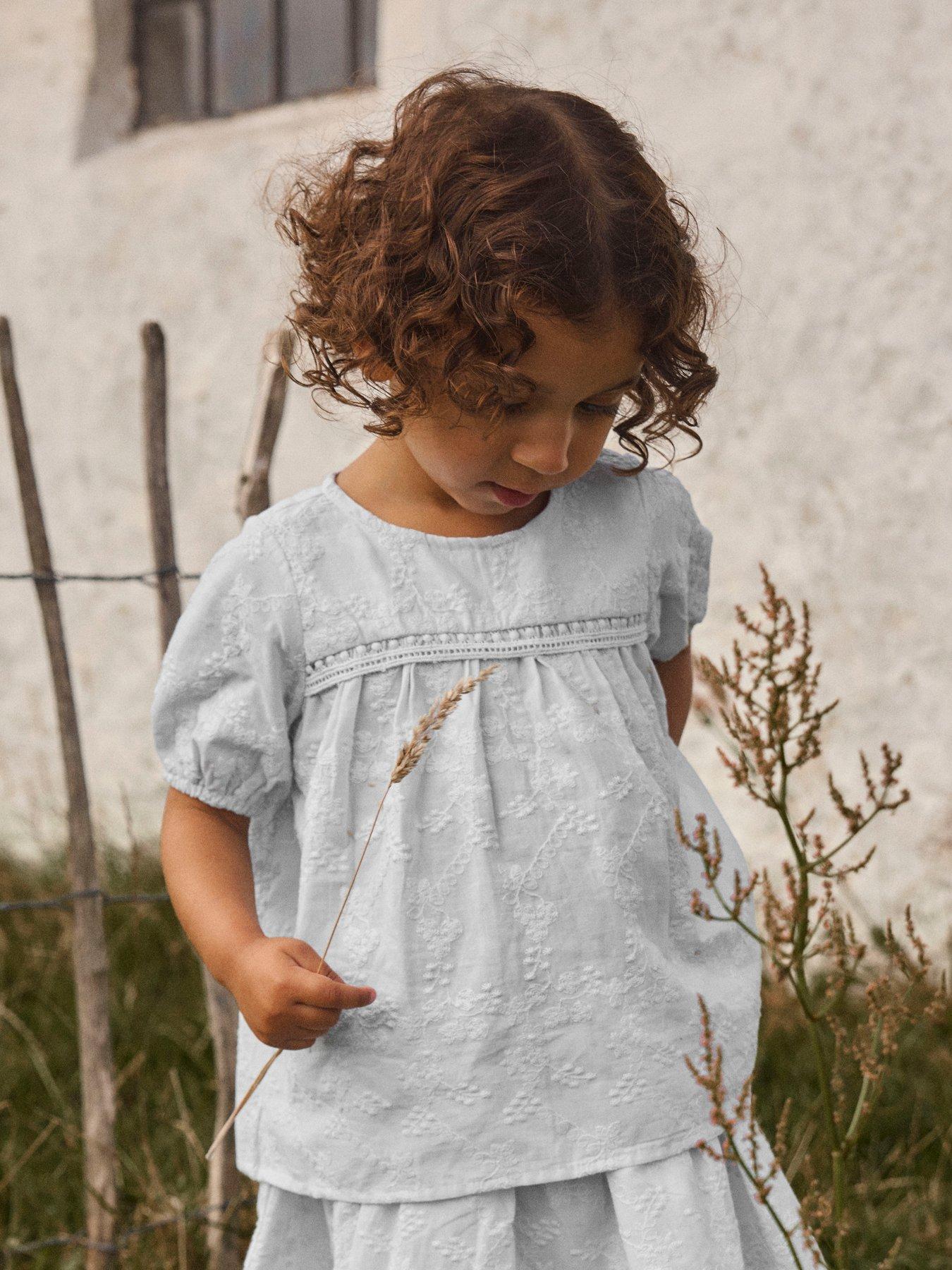 Image 1 of 5 of Lil Atelier Mini Girls Sibling Embroidered Short Sleeve Blouse - Light Blue