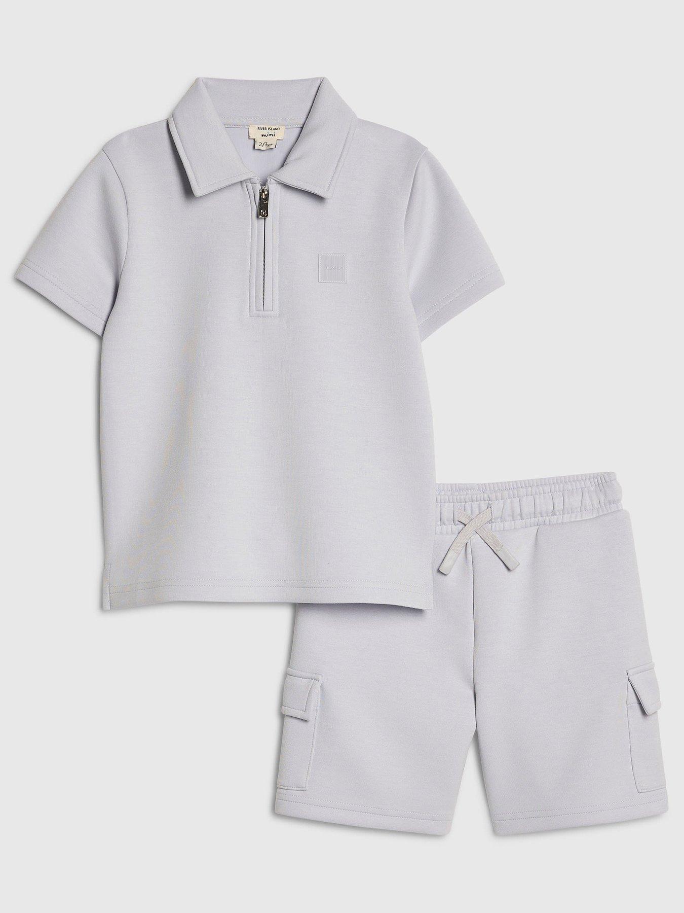 Image 1 of 5 of River Island Mini Mini Boys Luminis Badge Polo T-Shirt &amp; Shorts Set - Light Blue