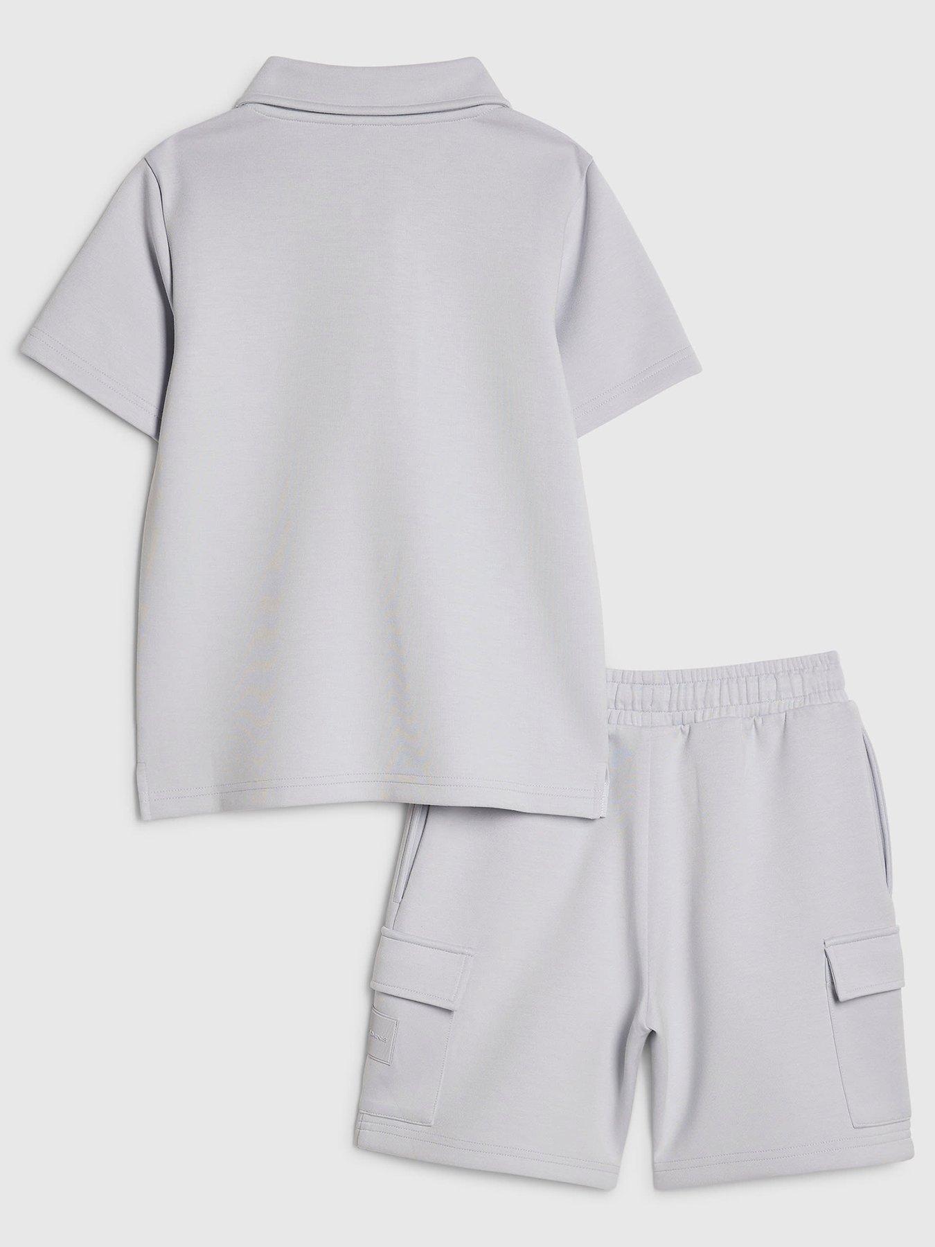 Image 2 of 5 of River Island Older Boys Luminis Badge Polo T-Shirt &amp; Shorts Set&nbsp;- Light Blue