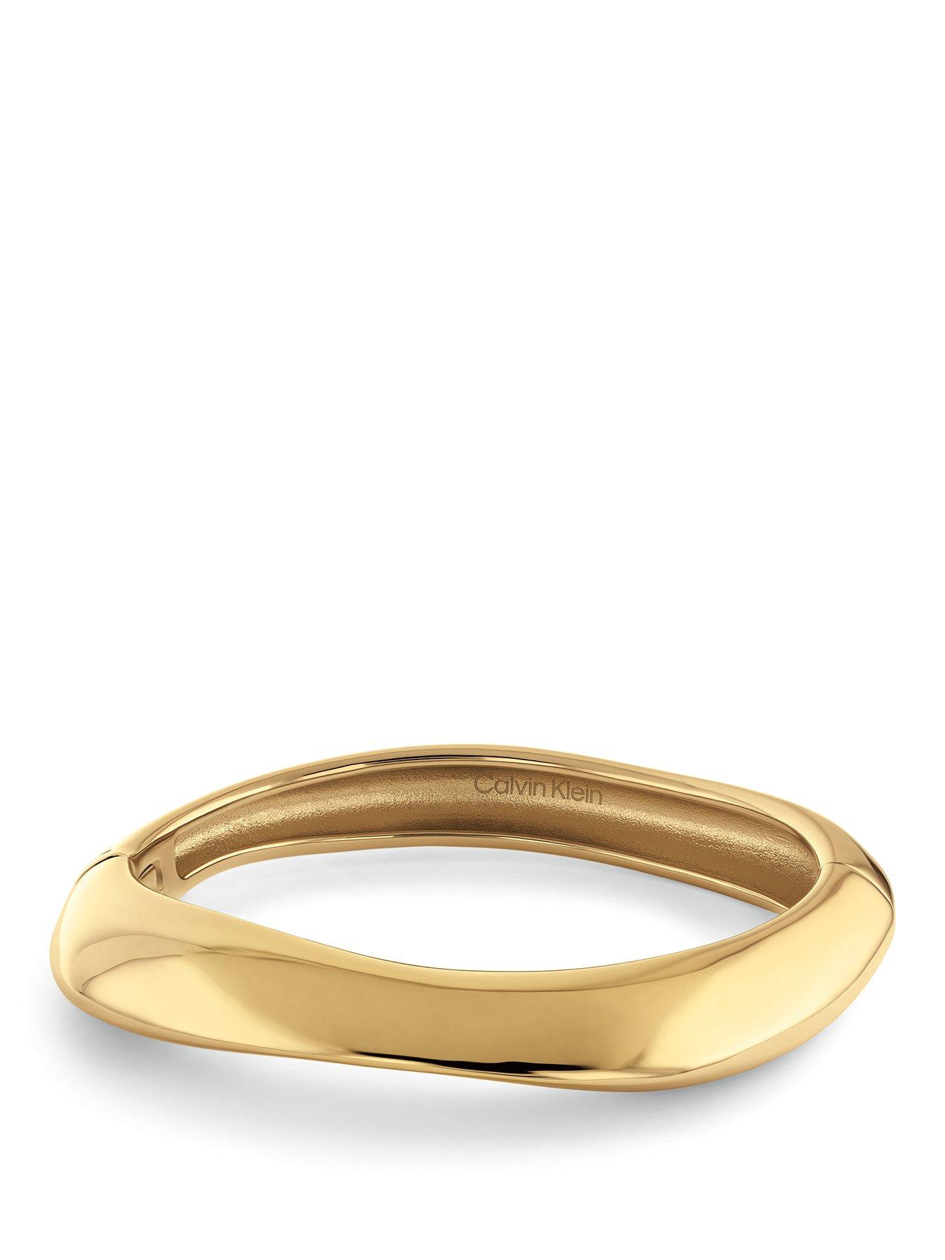 Image 1 of 4 of Calvin Klein Womens CK Sculpted Gold Plated Bangle