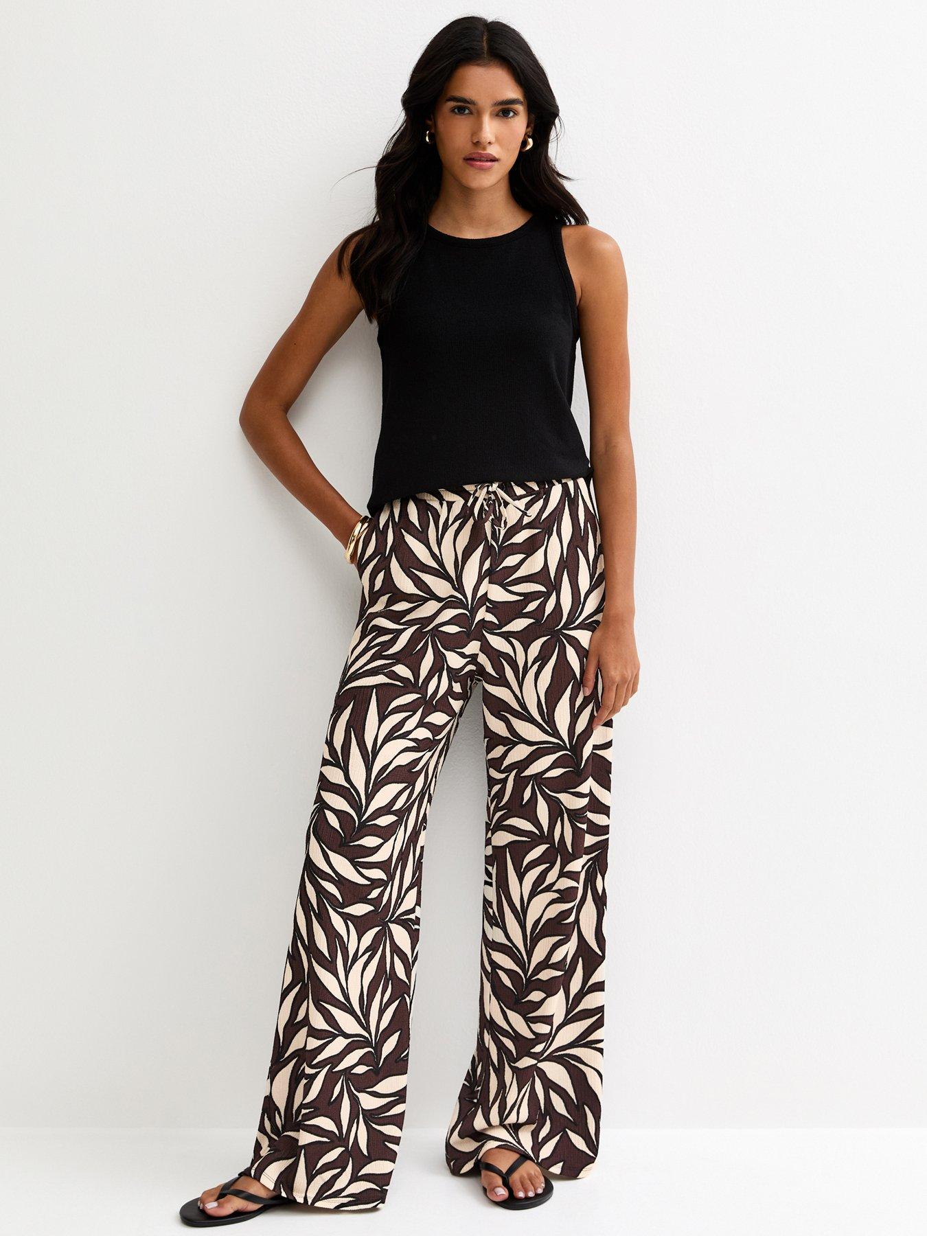 Image 1 of 5 of New Look Leaf Print Crinkle Texture Wide Leg Trousers - Brown