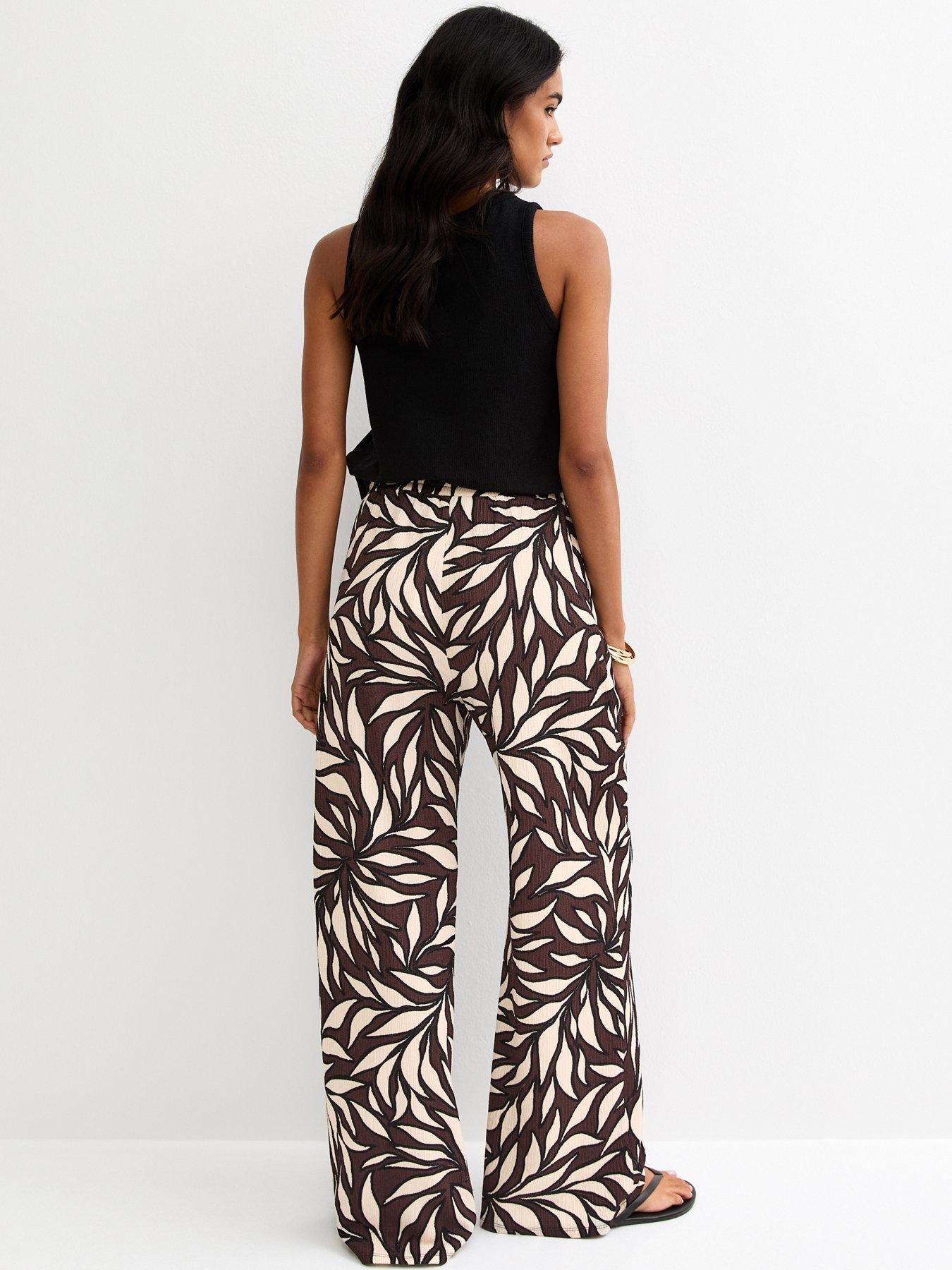 Image 2 of 5 of New Look Leaf Print Crinkle Texture Wide Leg Trousers - Brown
