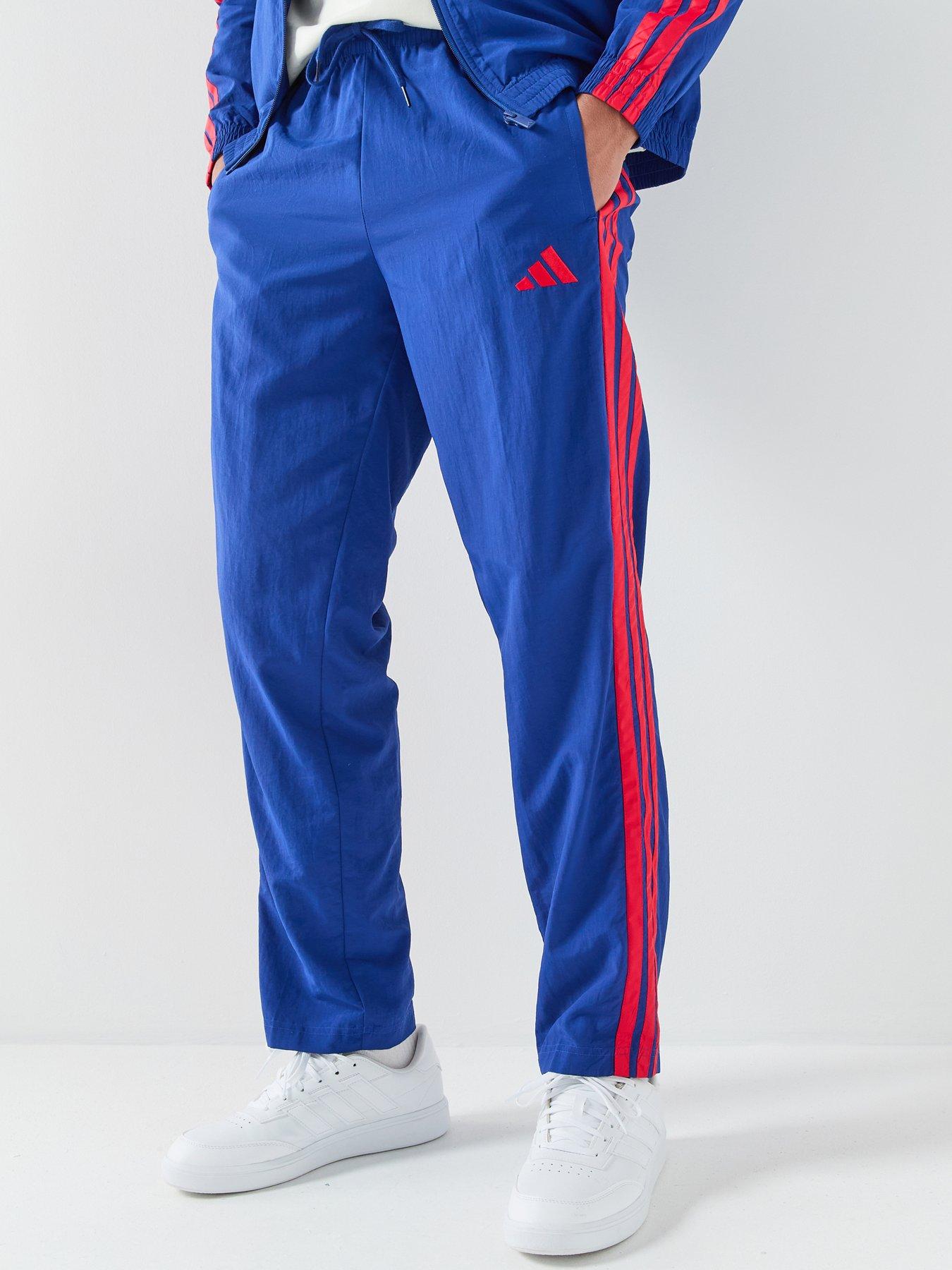 adidas Sportswear: Men's Essentials 3 Striipes Woven Open Hem Tracksuit Pants - Blue