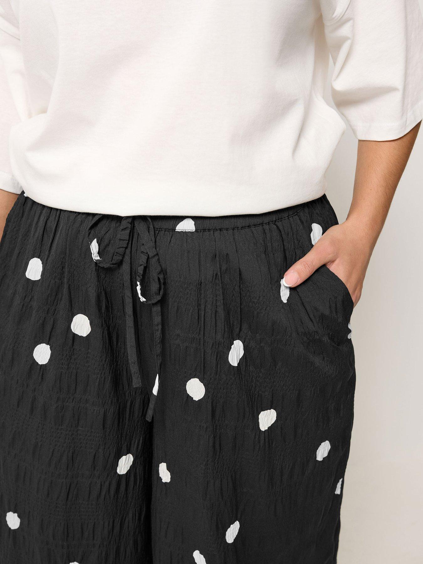 Image 4 of 5 of Yours Curve Woven Polka Dot Printed Trousers