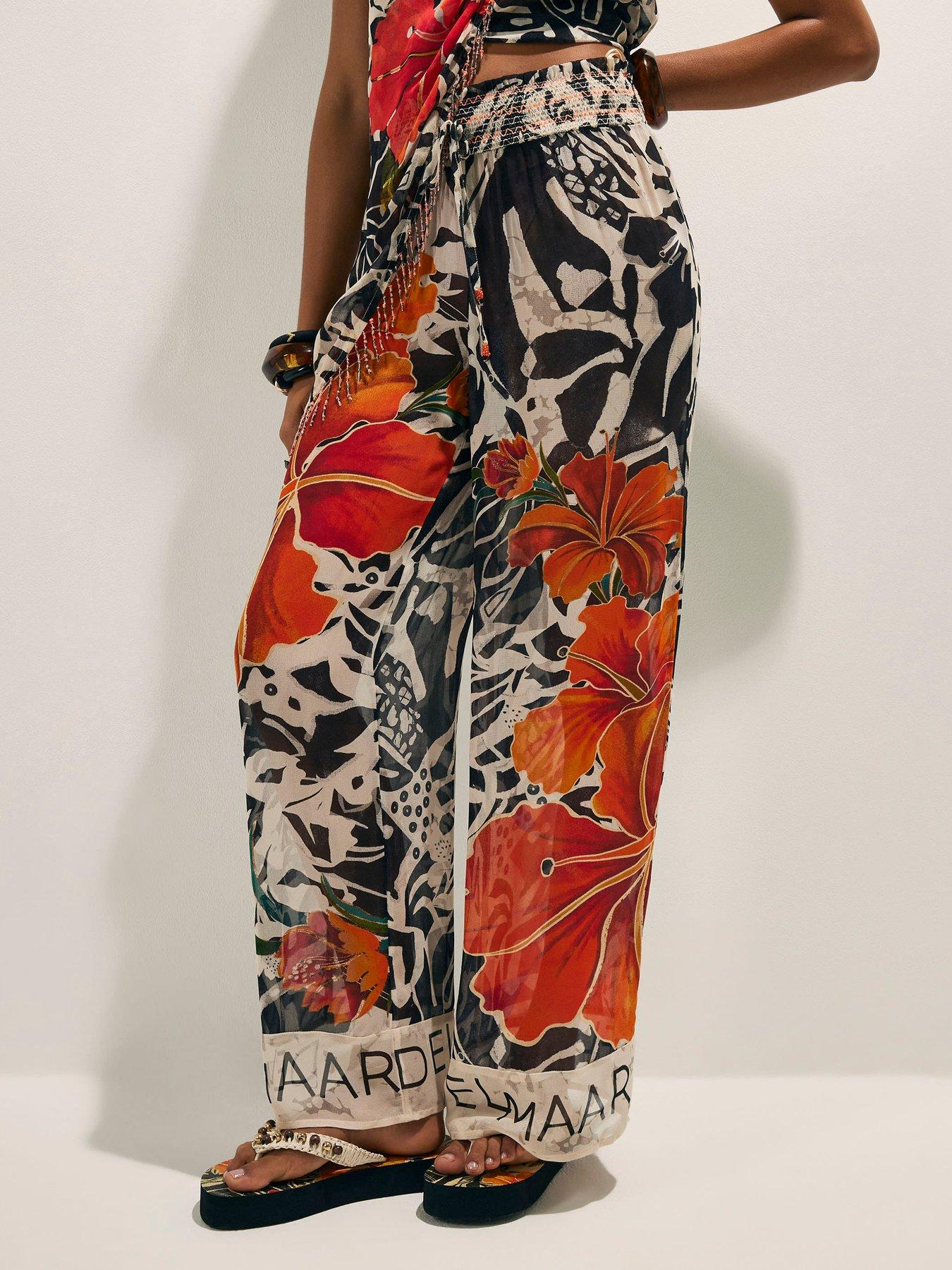 Image 1 of 6 of River Island Del Mar Wide Leg Floral Placed Trouser - Black