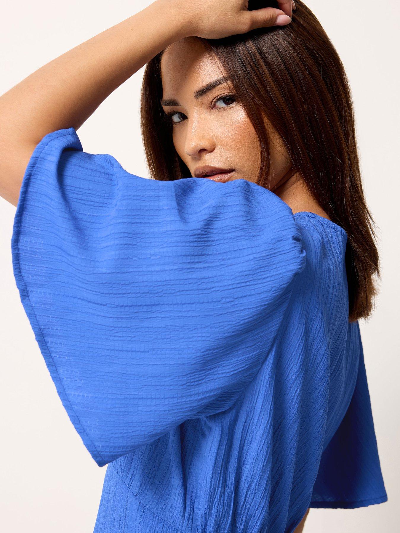 Image 4 of 5 of PixieGirl Petite Textured Asymmetrical Midi Dress - Blue