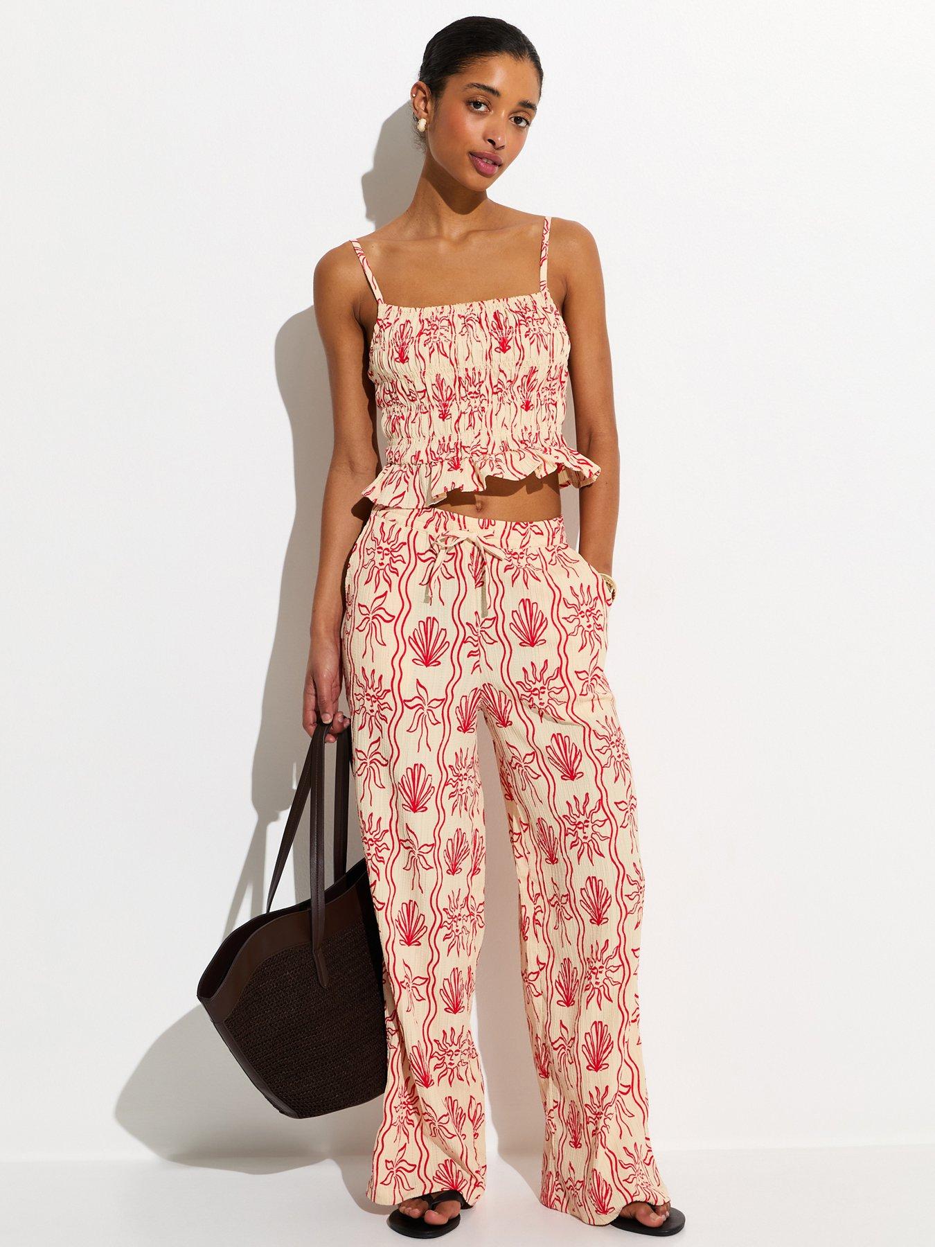 Image 1 of 6 of New Look Red Sun Print Wide Leg Beach Trousers