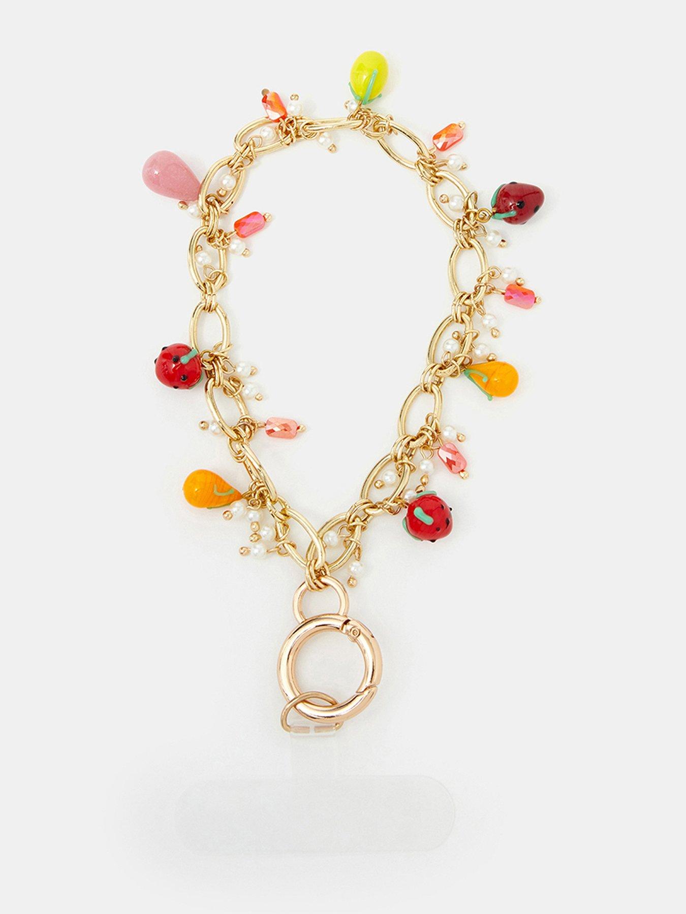 Image 1 of 4 of Accessorize Fruit Charm Wrist Phone Strap - Multi