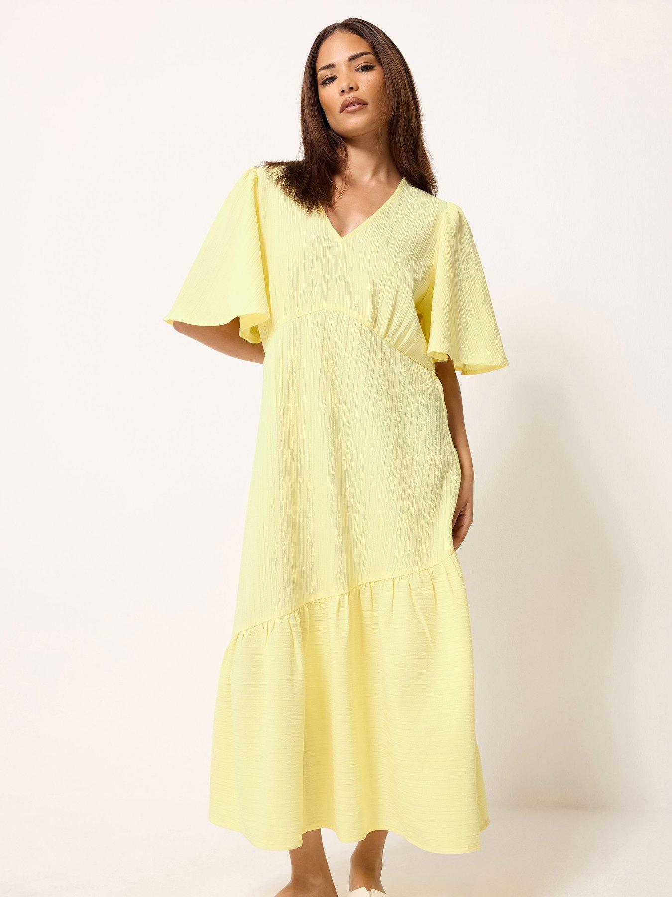Image 1 of 5 of PixieGirl Petite Textured Asymmetric Midi Dress - Yellow