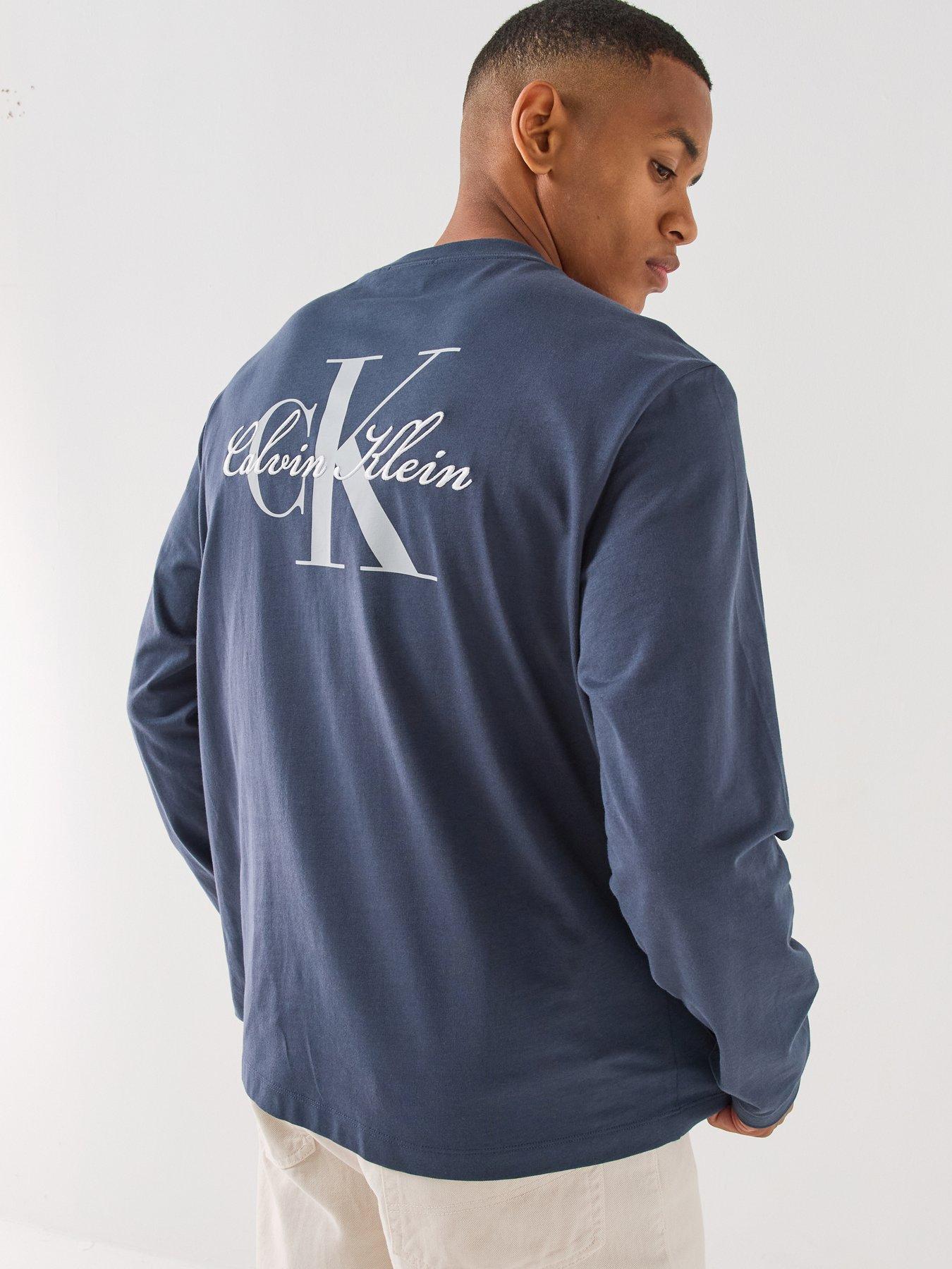Image 1 of 6 of Calvin Klein Jeans Mens Relaxed Back Graphic Long Sleeve T-Shirt - Blue