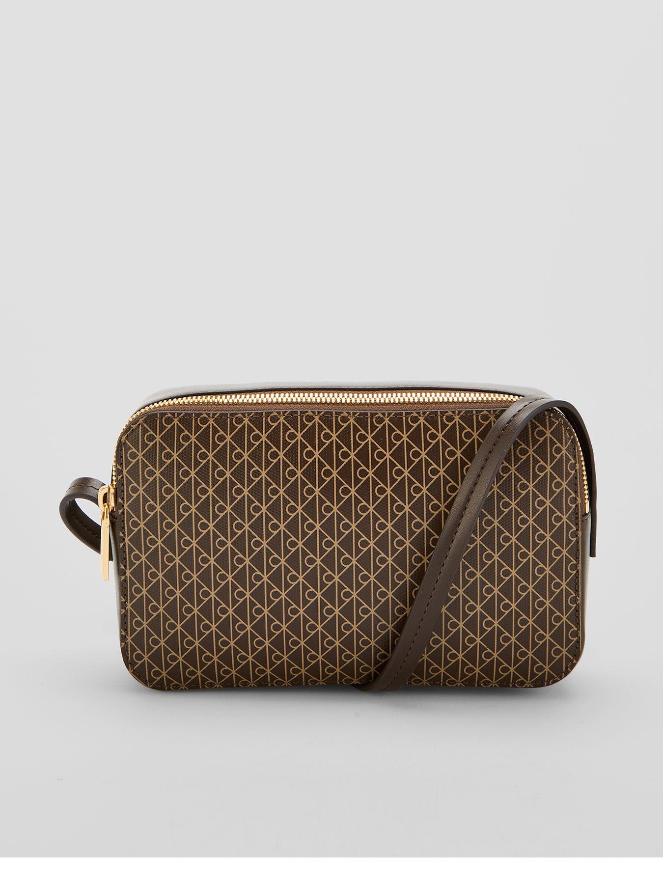 Image 1 of 5 of Calvin Klein Emblem Print Elongated Camera Bag - Brown