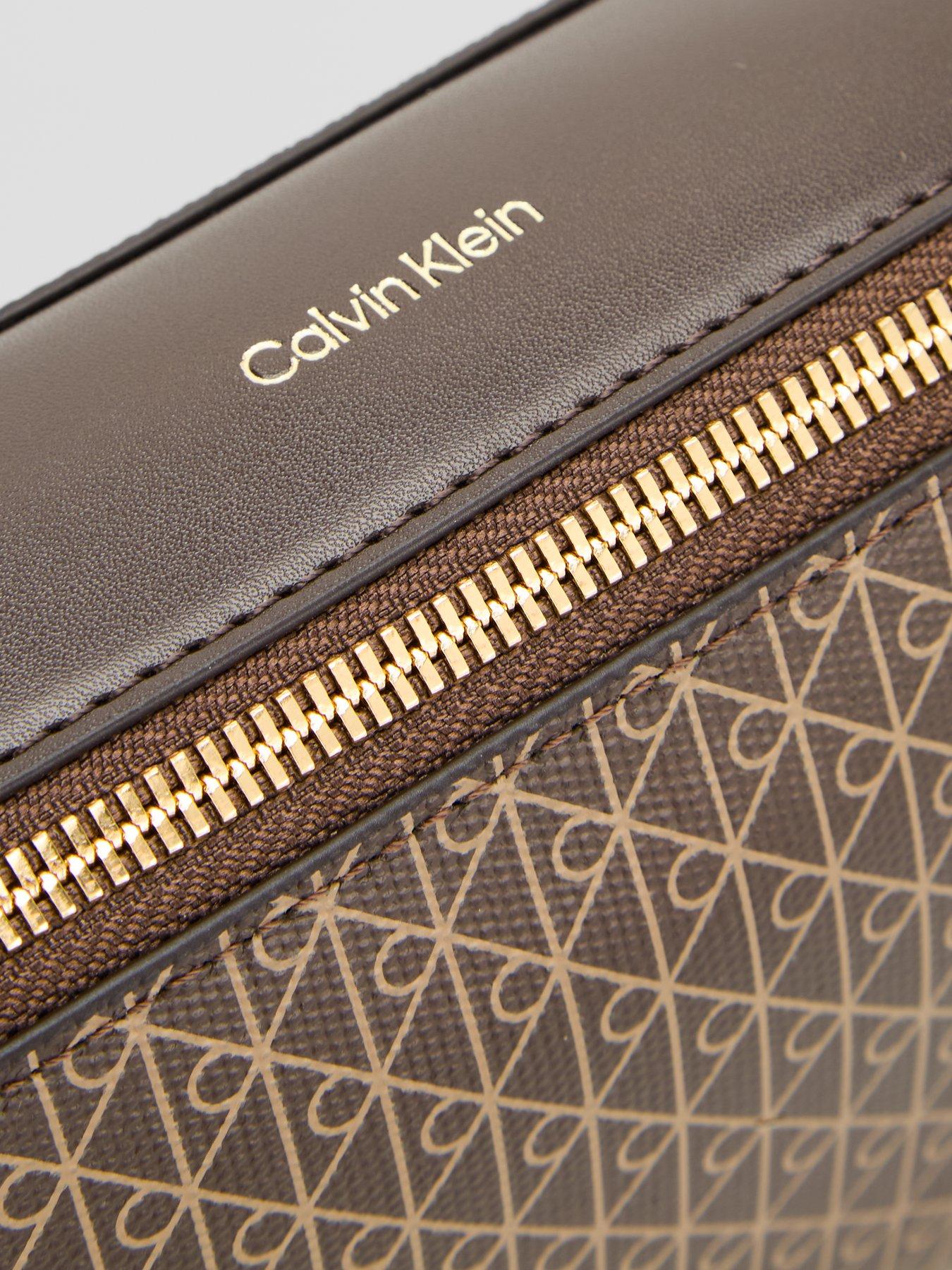 Image 5 of 5 of Calvin Klein Emblem Print Elongated Camera Bag - Brown