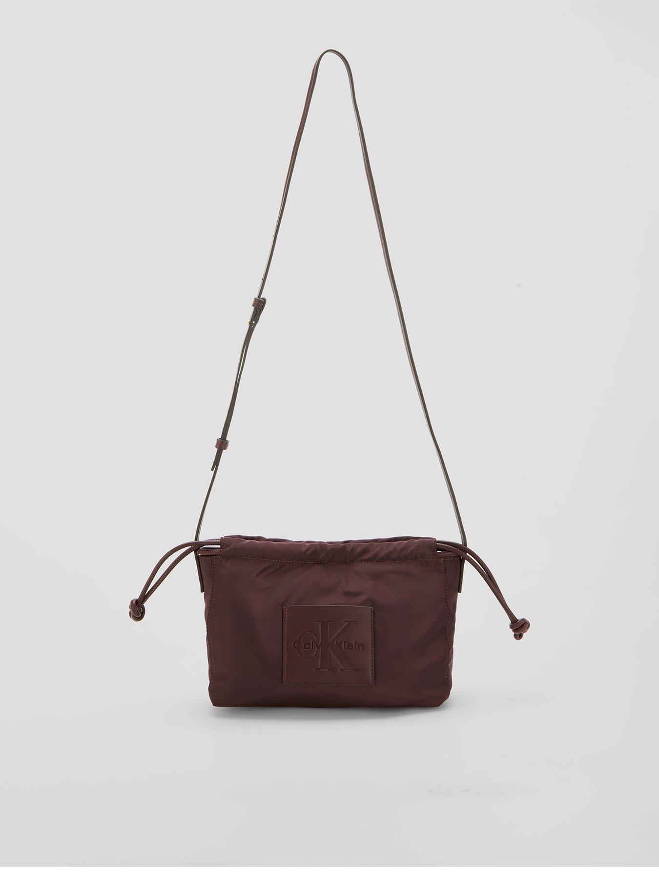 Image 1 of 5 of Calvin Klein Monologo Pocket Drawstring Crossbody Bag - Brown