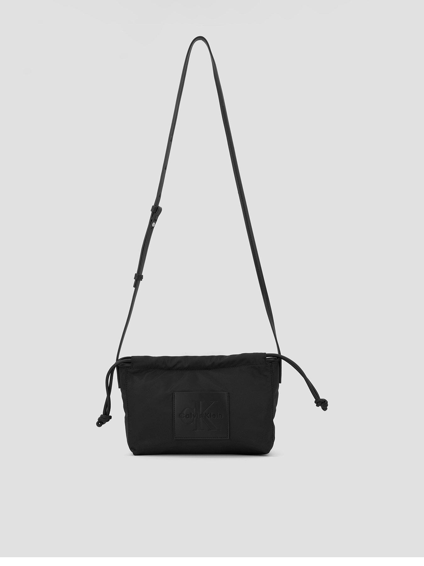 Image 1 of 6 of Calvin Klein Nylon Drawstring Small Crossbody Bag - Black