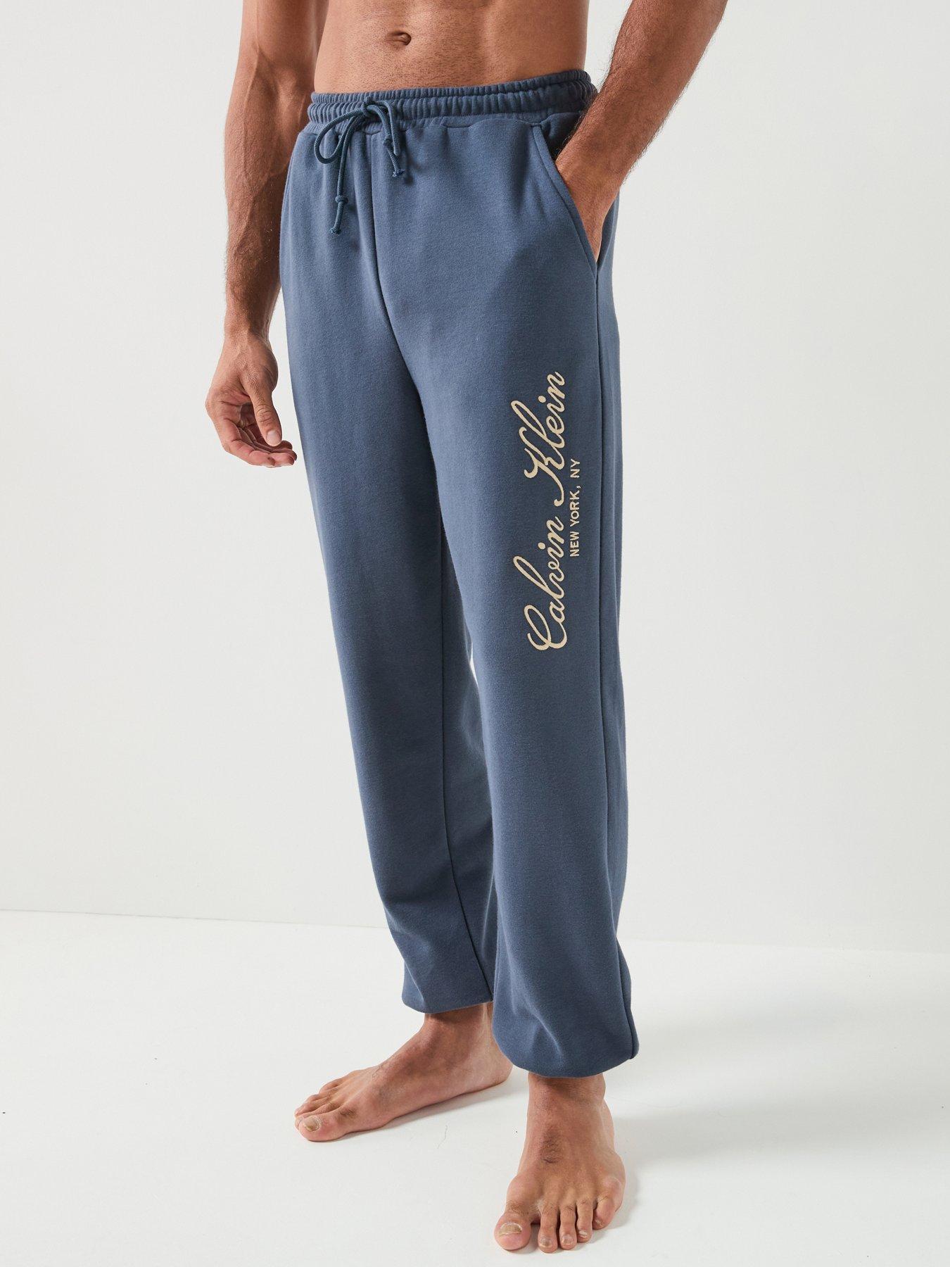 Image 1 of 6 of Calvin Klein Script Tracksuits - Blue