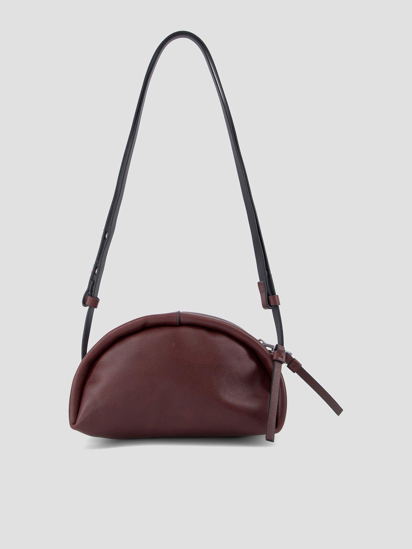 Image 1 of 5 of AllSaints Womens Smooth Leather Curved Zip-Top Crossbody Bag - Red