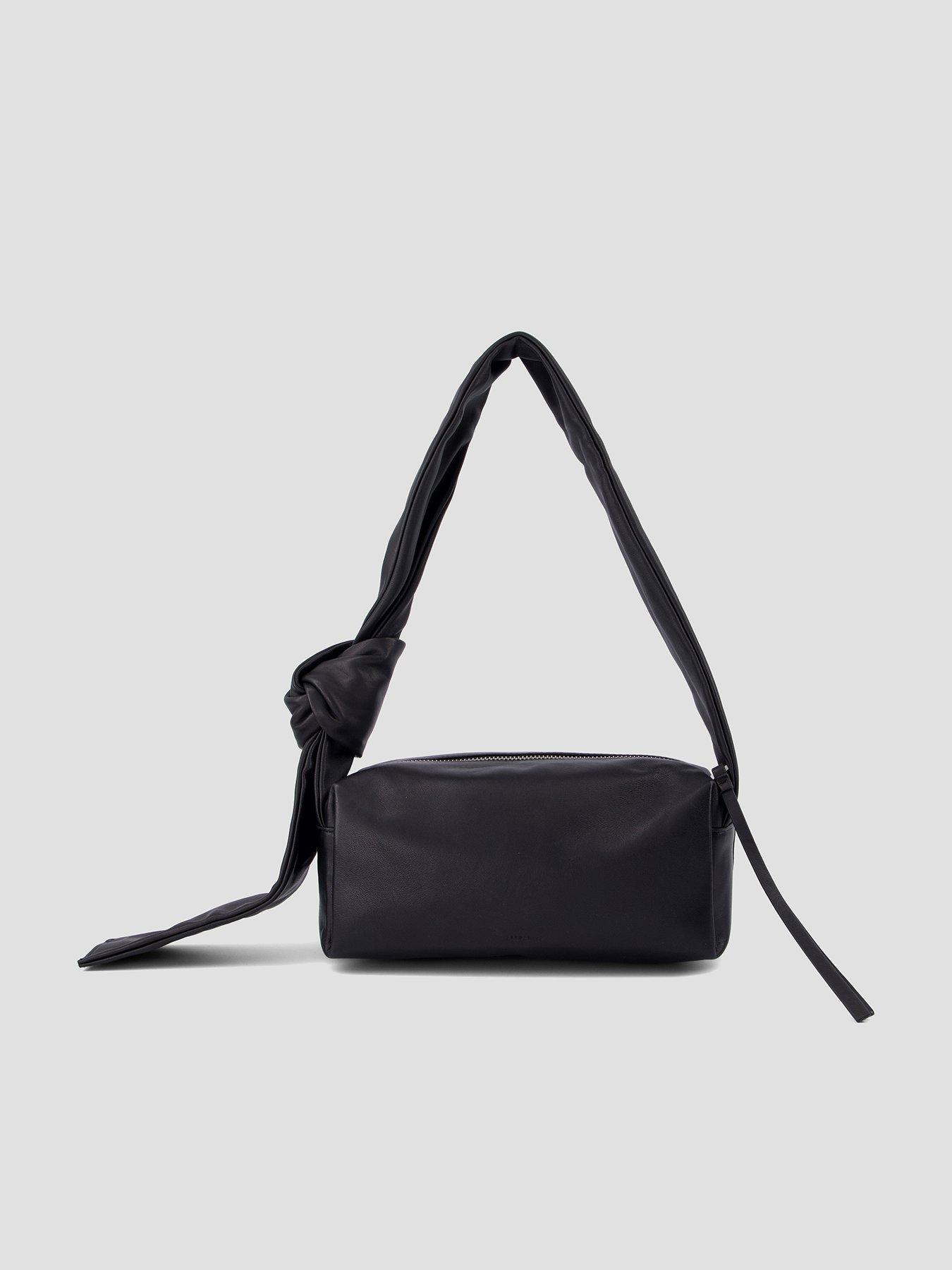 Image 1 of 5 of AllSaints Womens Knotted Strap Zip-Top Baguette Shoulder Bag - Black