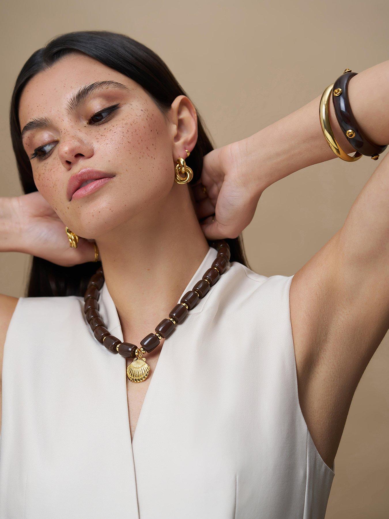 Image 1 of 7 of Orelia Statement Brown Bead Shell Drop Necklace